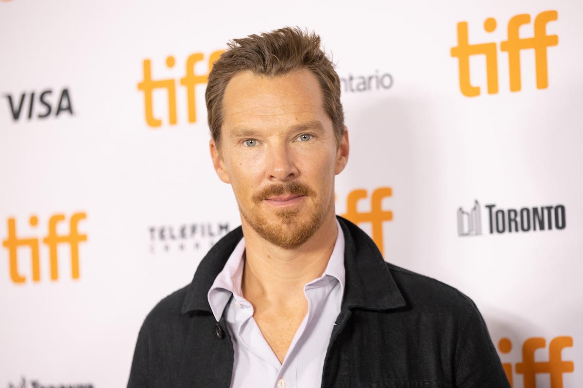 Benedict Cumberbatch smiling in front of a white background