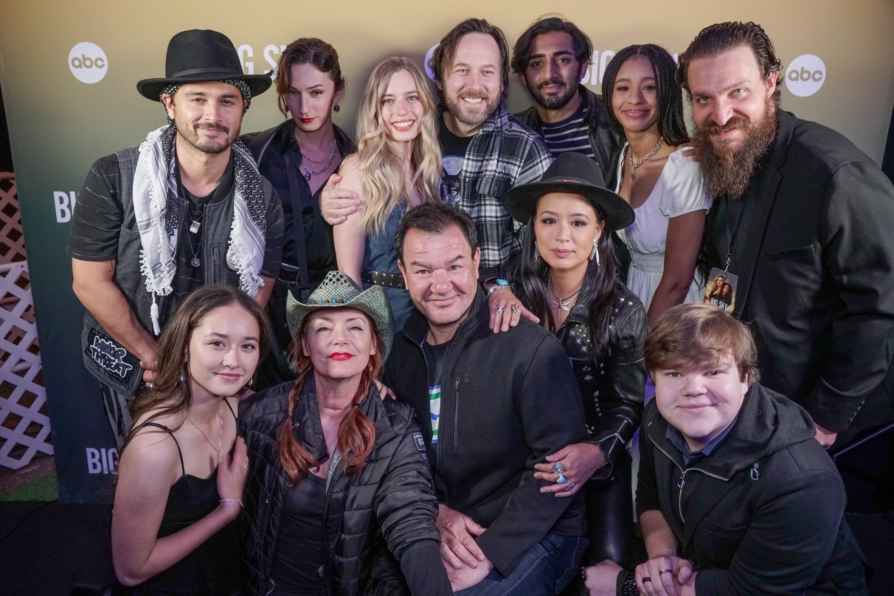 Some 'Big Sky' Season 2 Episode 2 cast smiling for the cameras: Michael Malarkey, Jessie James Keitel, Arturo Del Puerto, Anja Savcic, Vinny Chibber, Troy Leigh-Anne Johnson, Ryan DeQuintal, Madelyn Kientz, Dedee Pfeiffer, Patrick Gallagher, T. V. Carpio and Jeremy Ray Taylor