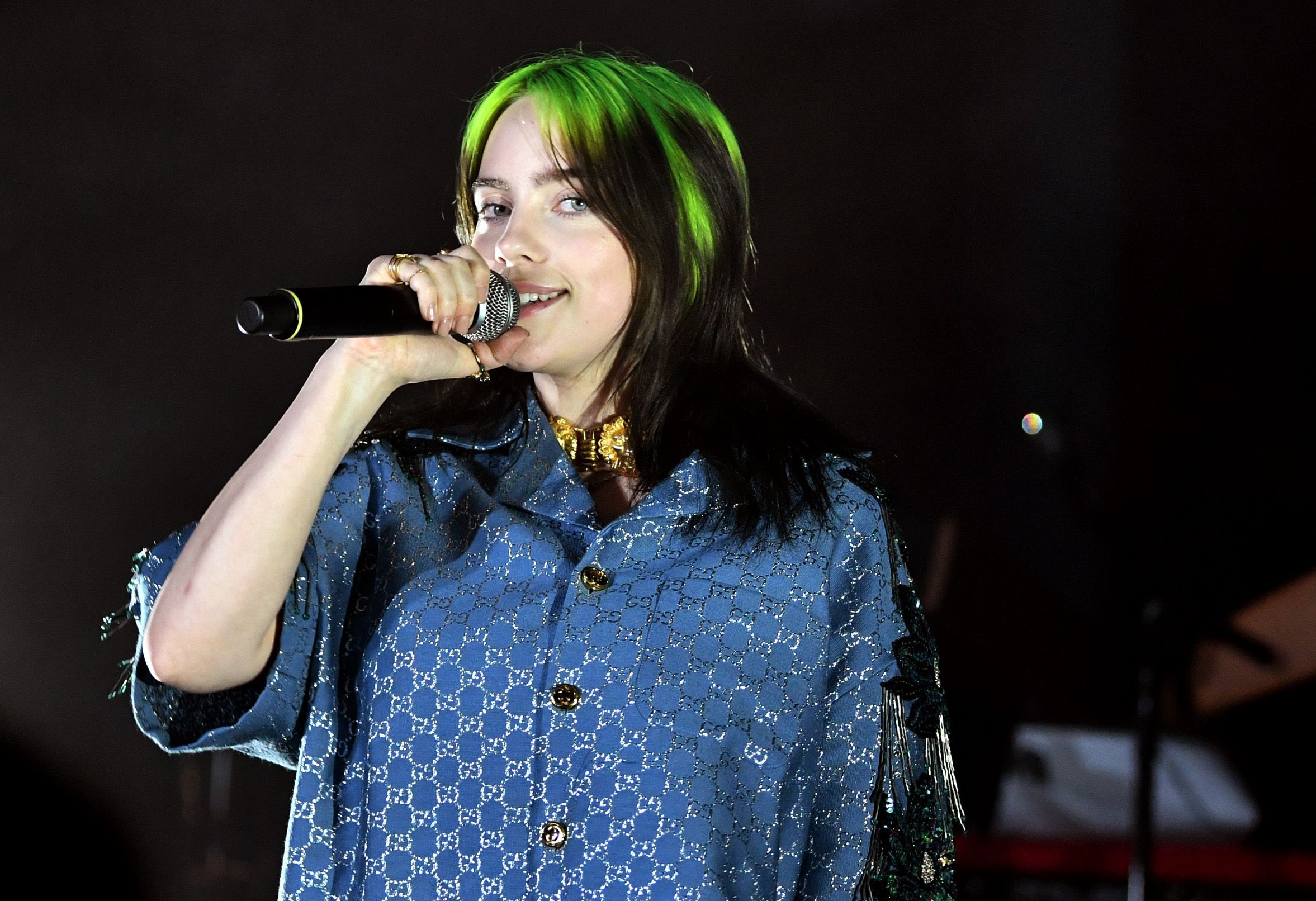 Billie Eilish, wearing Gucci, speaks on stage at the 2019 LACMA Art + Film Gala Presented By Gucci