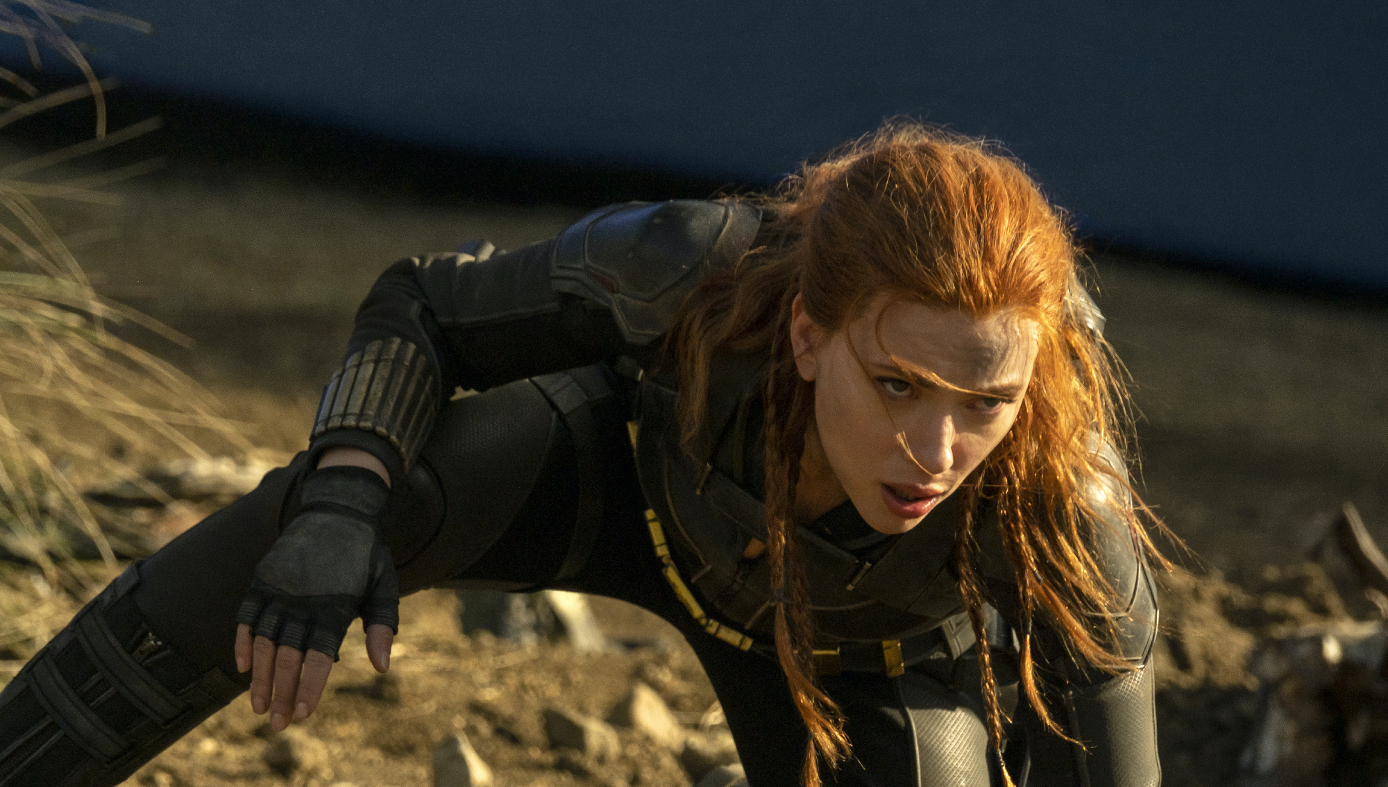 'Black Widow' star Scarlett Johansson crouching in a superhero pose wearing black costume