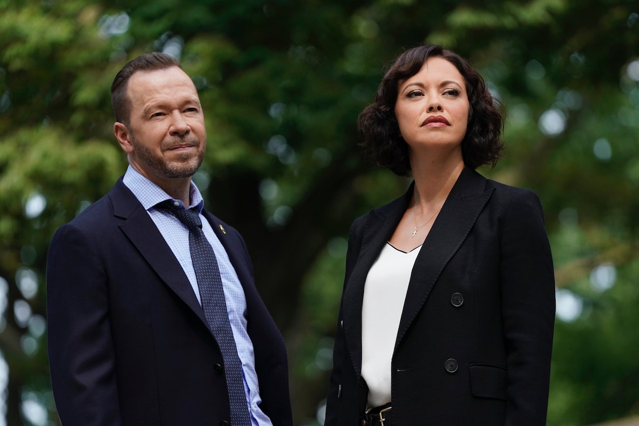 Donnie Wahlberg as Danny Reagan and Marisa Ramirez as Det. Maria Baez stand next to each other on 'Blue Bloods'