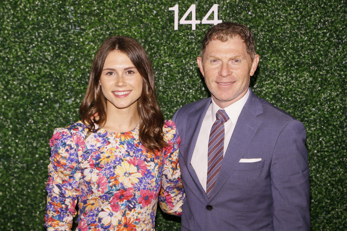 Bobby Flay and his daughter Sophie Flay at Pimlico Race Track on May 18, 2019 in Baltimore, Maryland