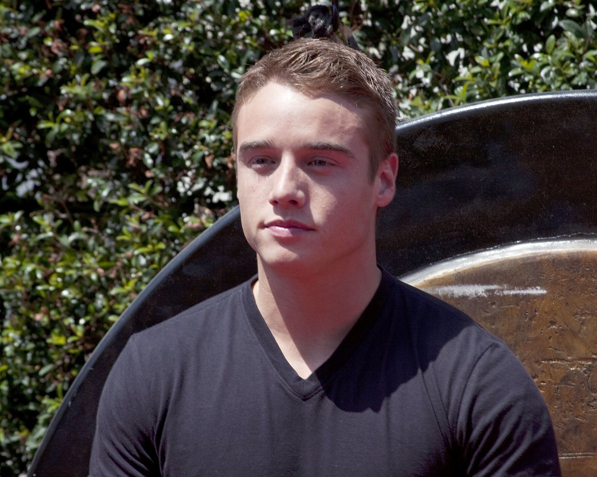 Actor Brando Eaton, who played Jonah in 'Dexter,' has a neutral expression on his face and wears a black v-neck shirt.