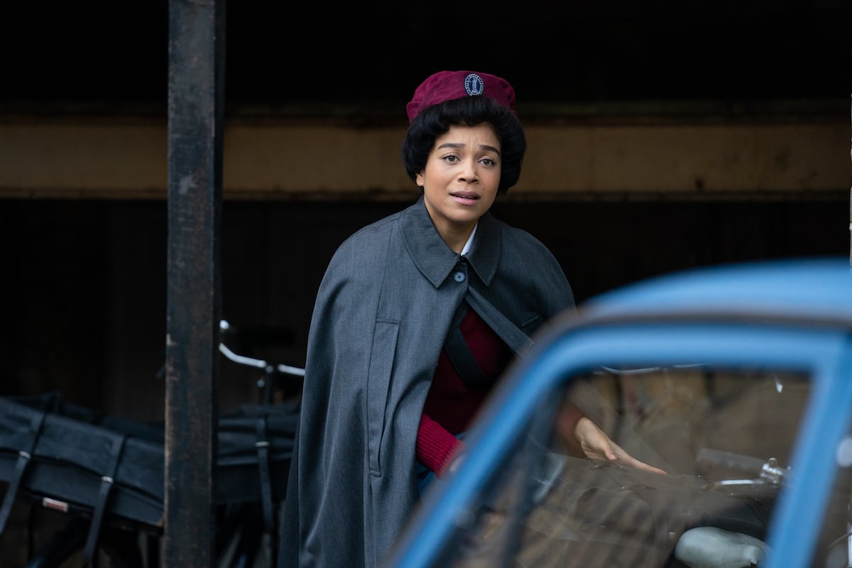 Nurse Anderson standing by a car in 'Call the Midwife' Season 10