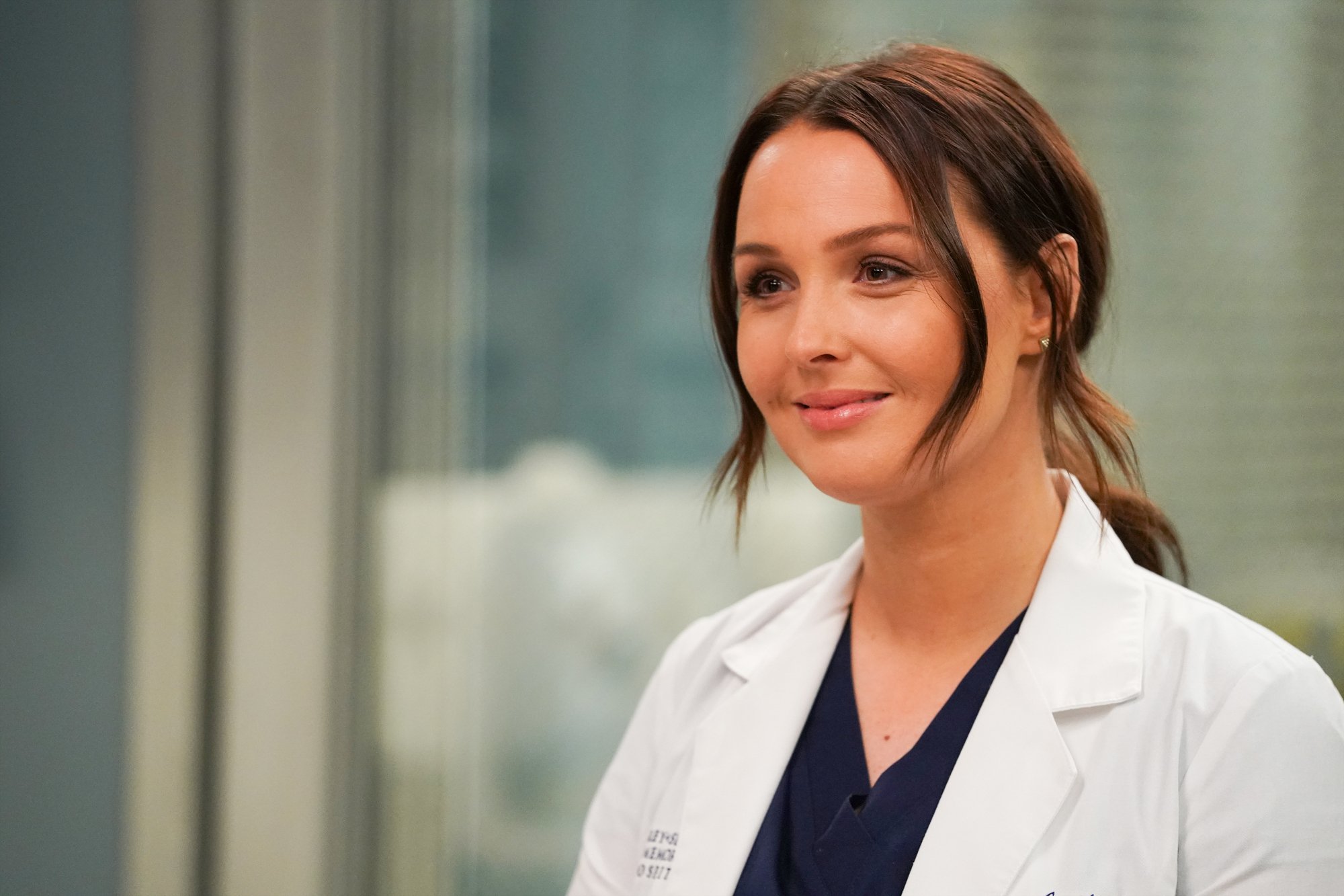 Camilla Luddington as Jo in 'Grey's Anatomy.' She's wearing blue scrubs and her hair is in a ponytail.