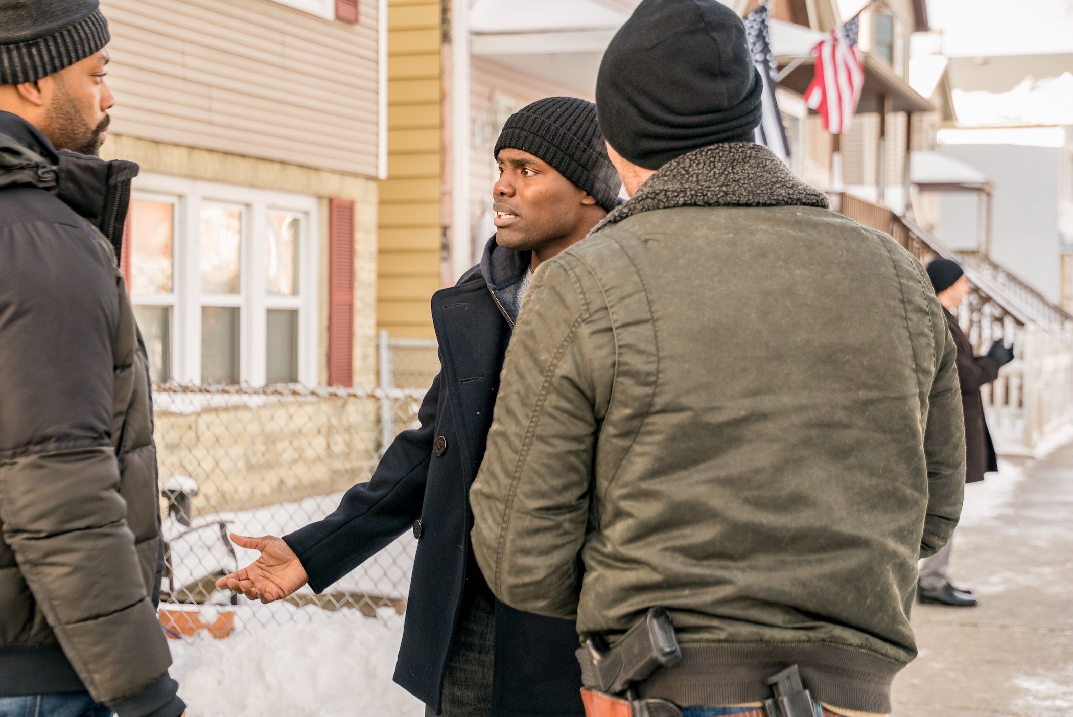 LaRoyce Hawkins as Kevin Atwater and Cleveland Berto as Andre Cooper, two 'Chicago P.D.' cast members in season 8 talking to each other outside during the winter. Fans want to know if Berto will rejoin the cast in 'Chicago P.D.' Season 9