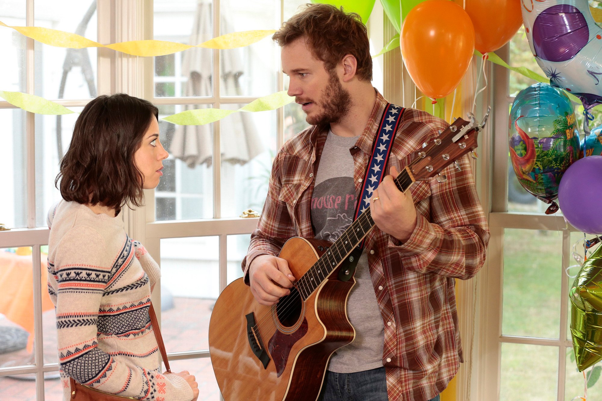 Chris Pratt plays guitar at a birthday party with Aubrey Plaza