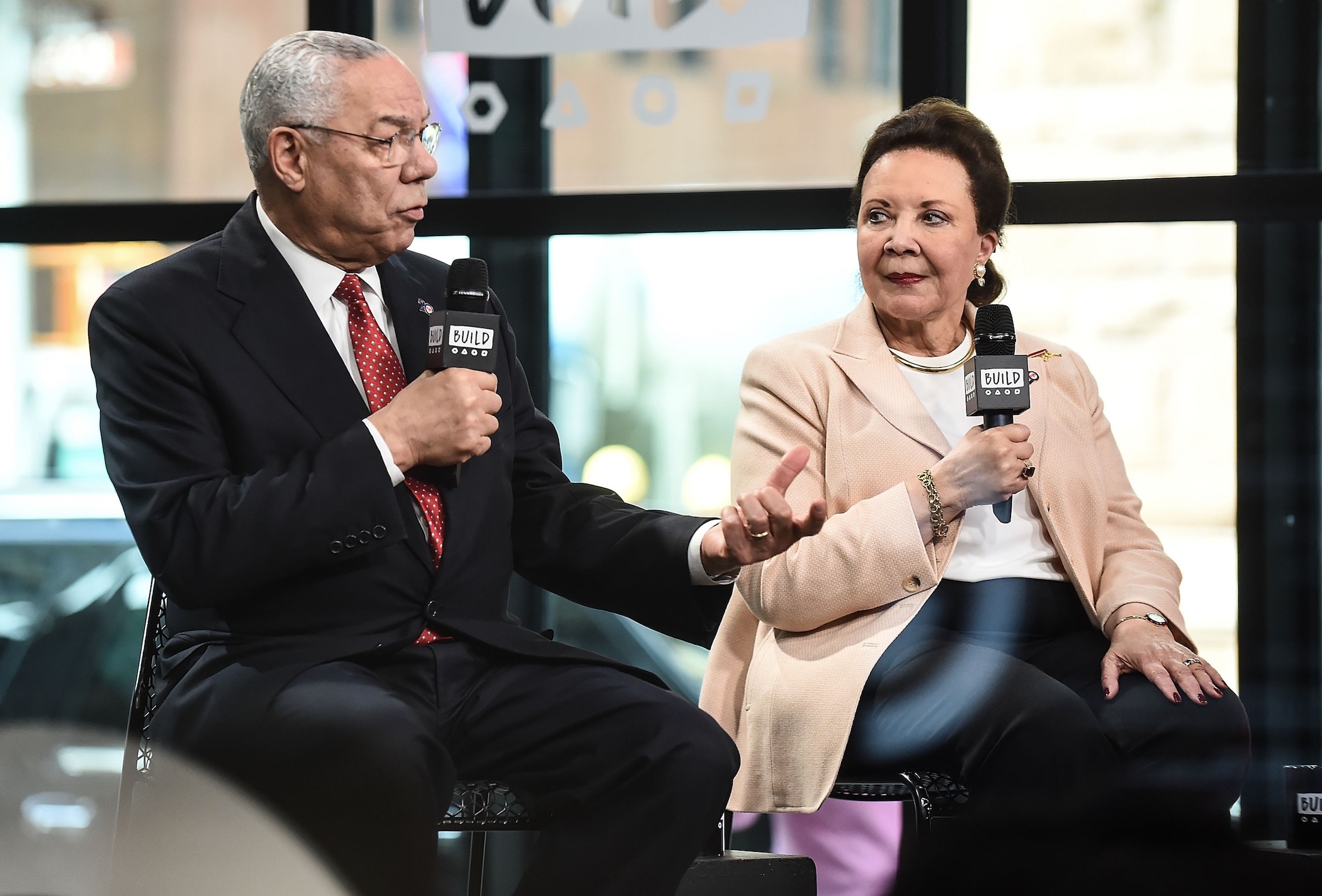 Colin Powell and Colin Powell's wife, Alma Powell, speaking at an event