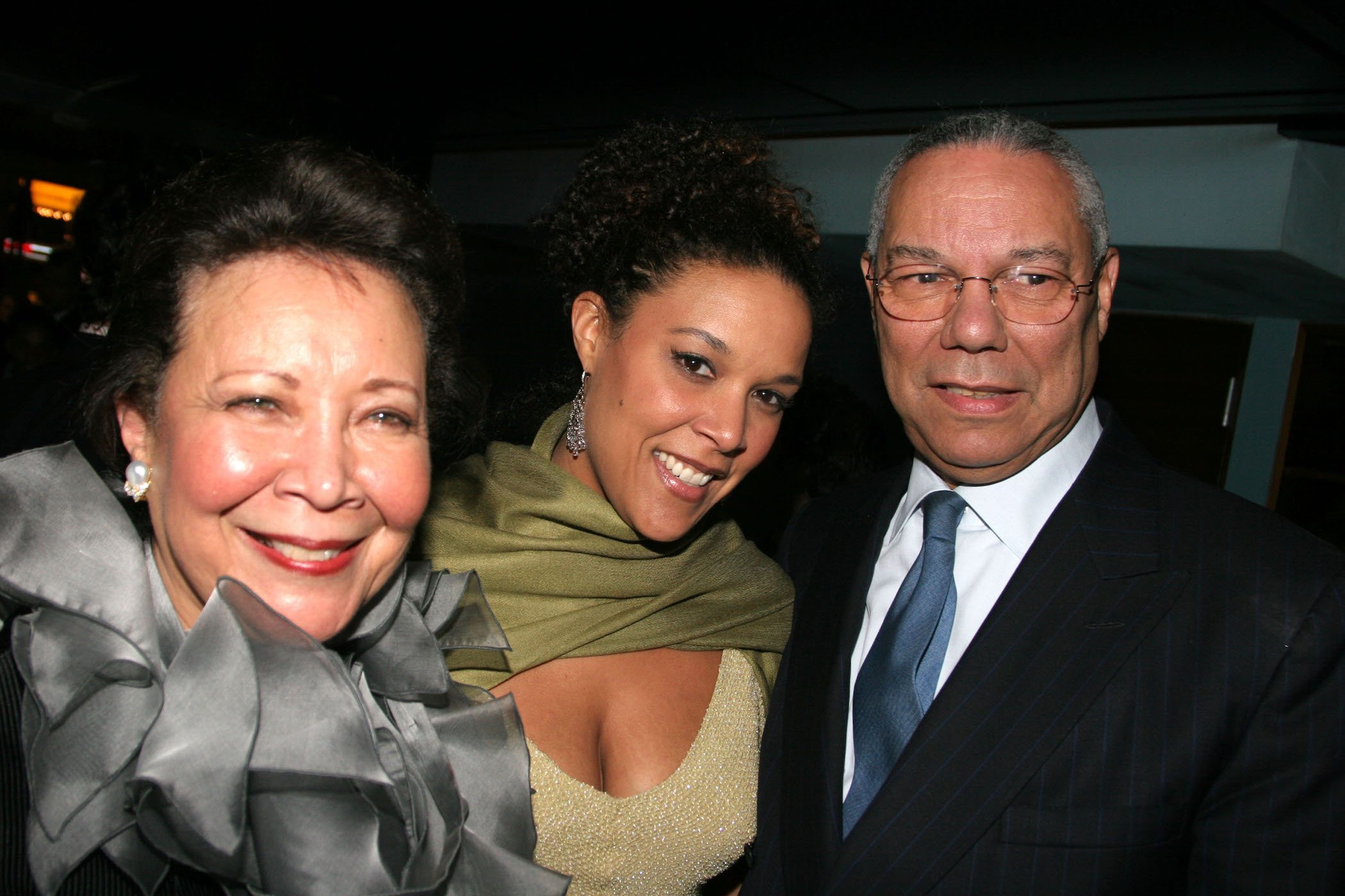 Colin Powell's wife, Alma Powell, and one of Colin Powell's children, Linda Powell, with Colin Powell at an event