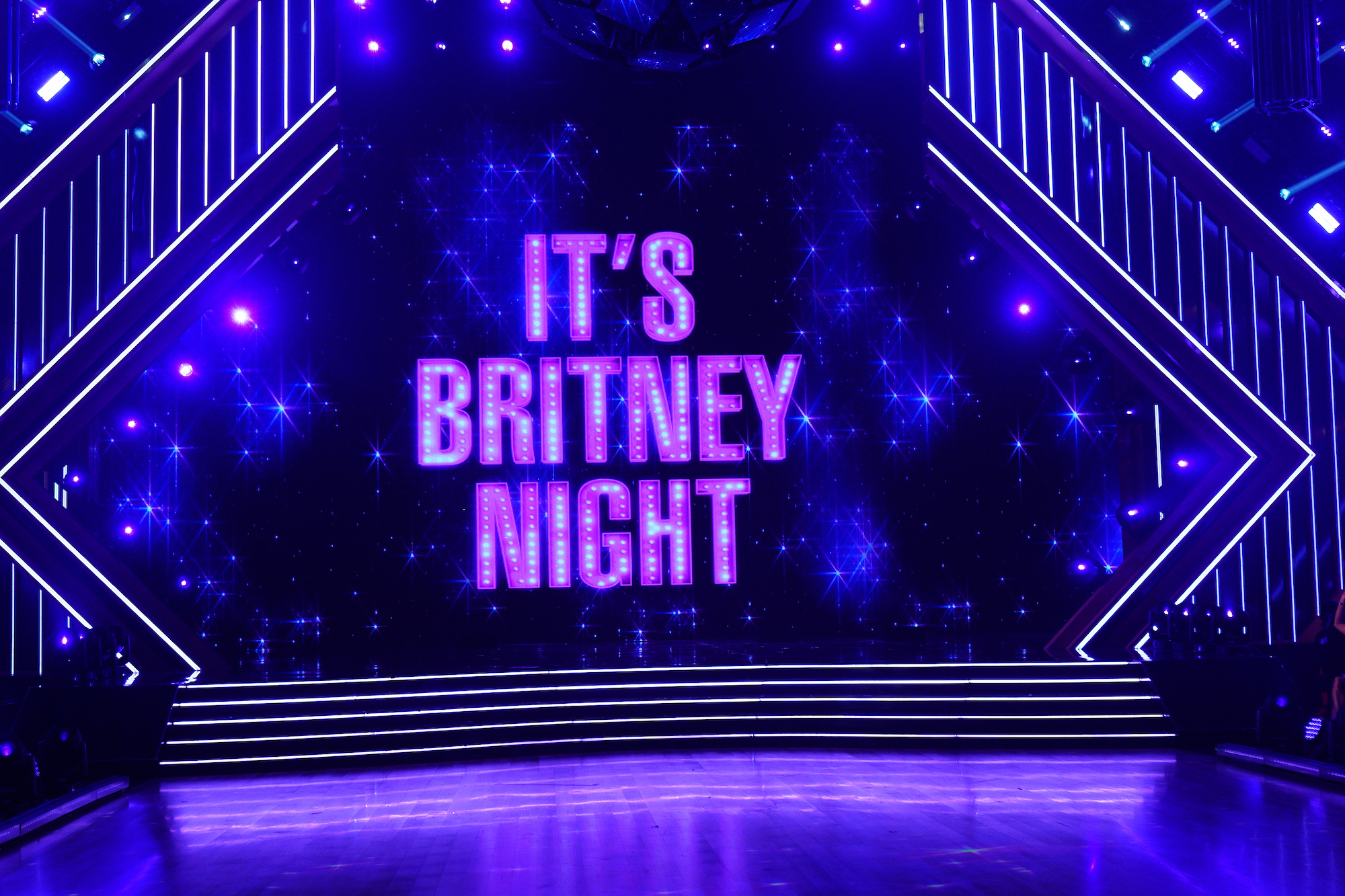 A screen reads 'It's Britney Night' in the 'Dancing with the Stars' ballroom during Britney Spears night in season 30