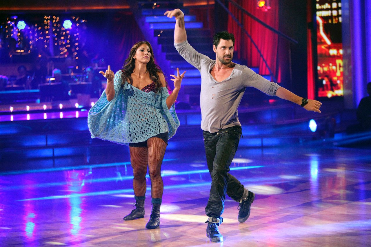 Hope Solo and Maksin Chmerkovskiy dance on the stage of 'Dancing with the Stars'