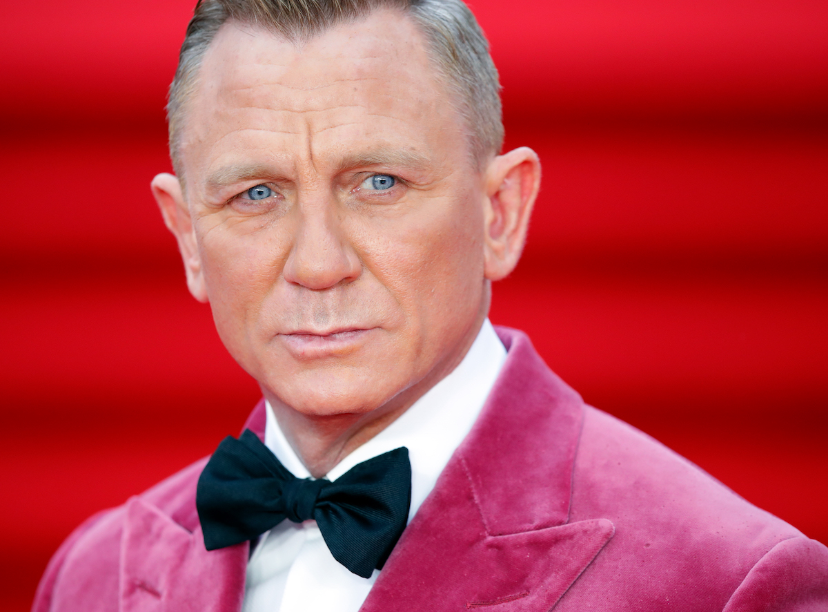 Daniel Craig wearing pink jacket at No Time to Die premiere