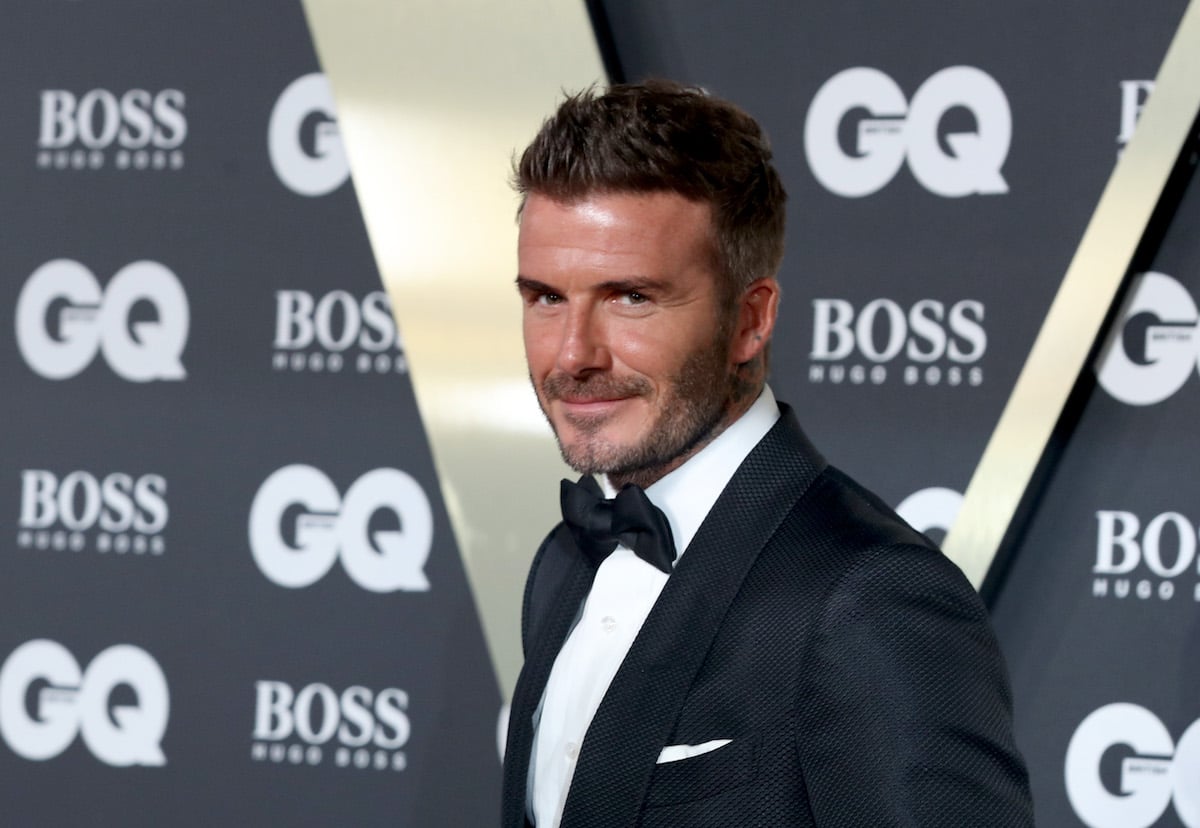 David Beckham wears a tuxedo at an event.