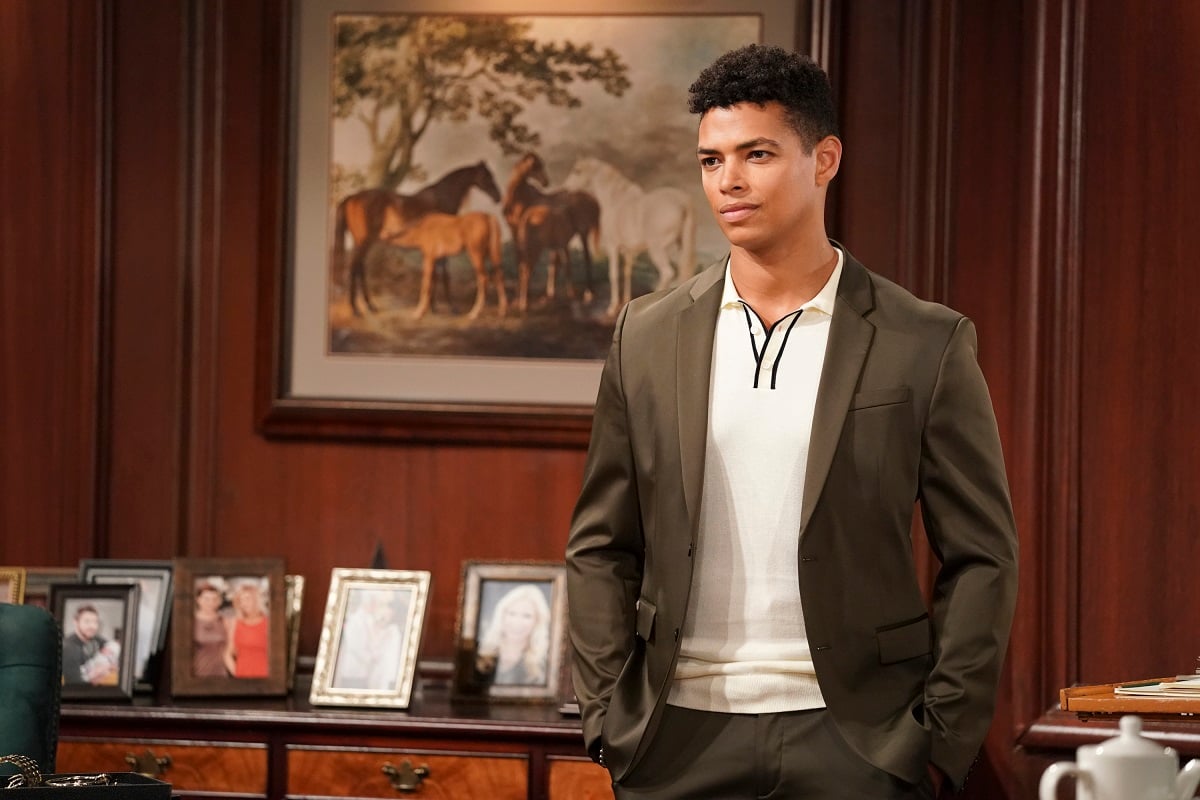 'The Bold and the Beautiful' actor Delon de Metz in a brown suit and white shirt in the Forrester Creations CEO office.