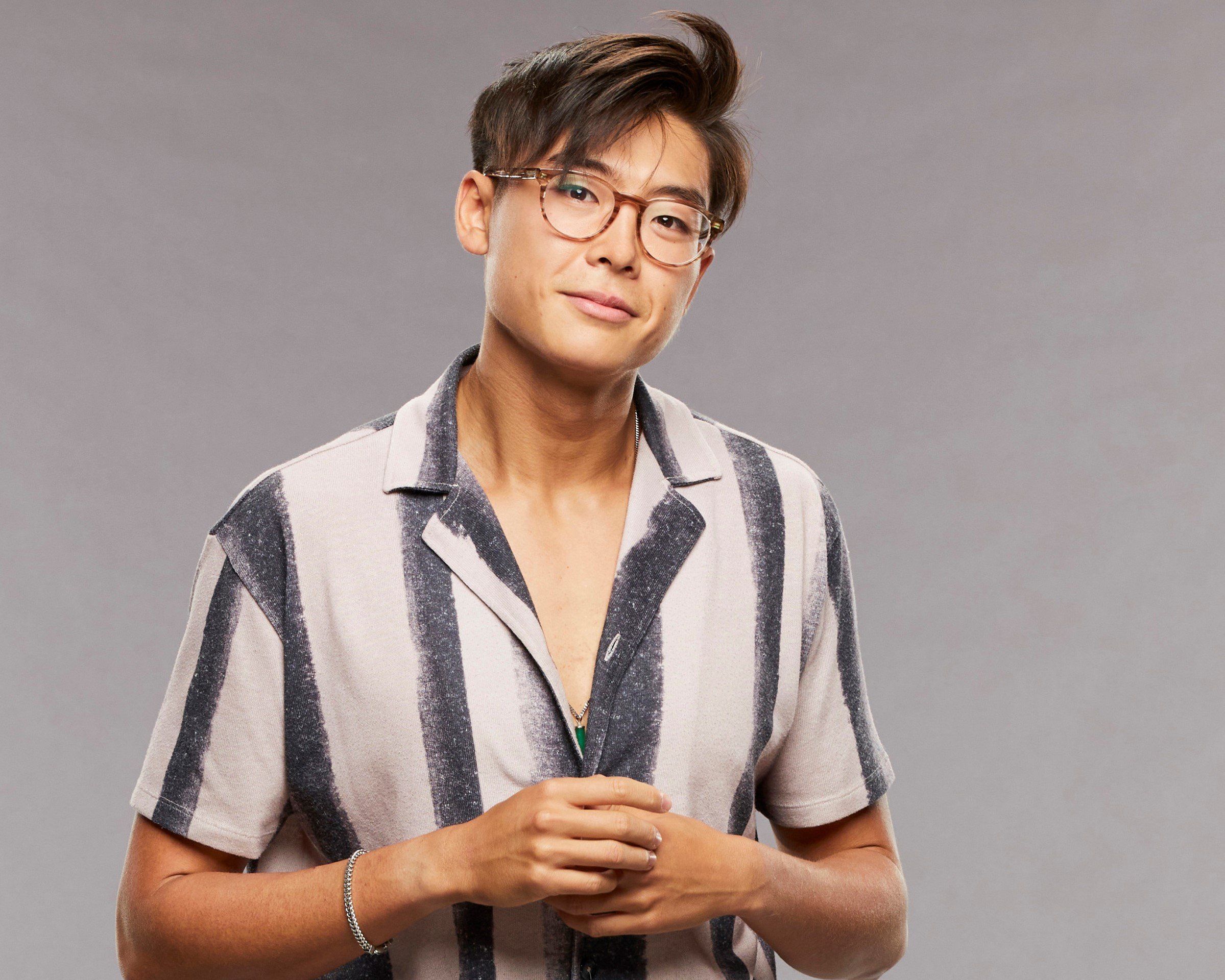 'Big Brother 23' star Derek Xiao, who is now dating fellow contestant Claire Rehfuss, wears a white shirt with black vertical stripes.