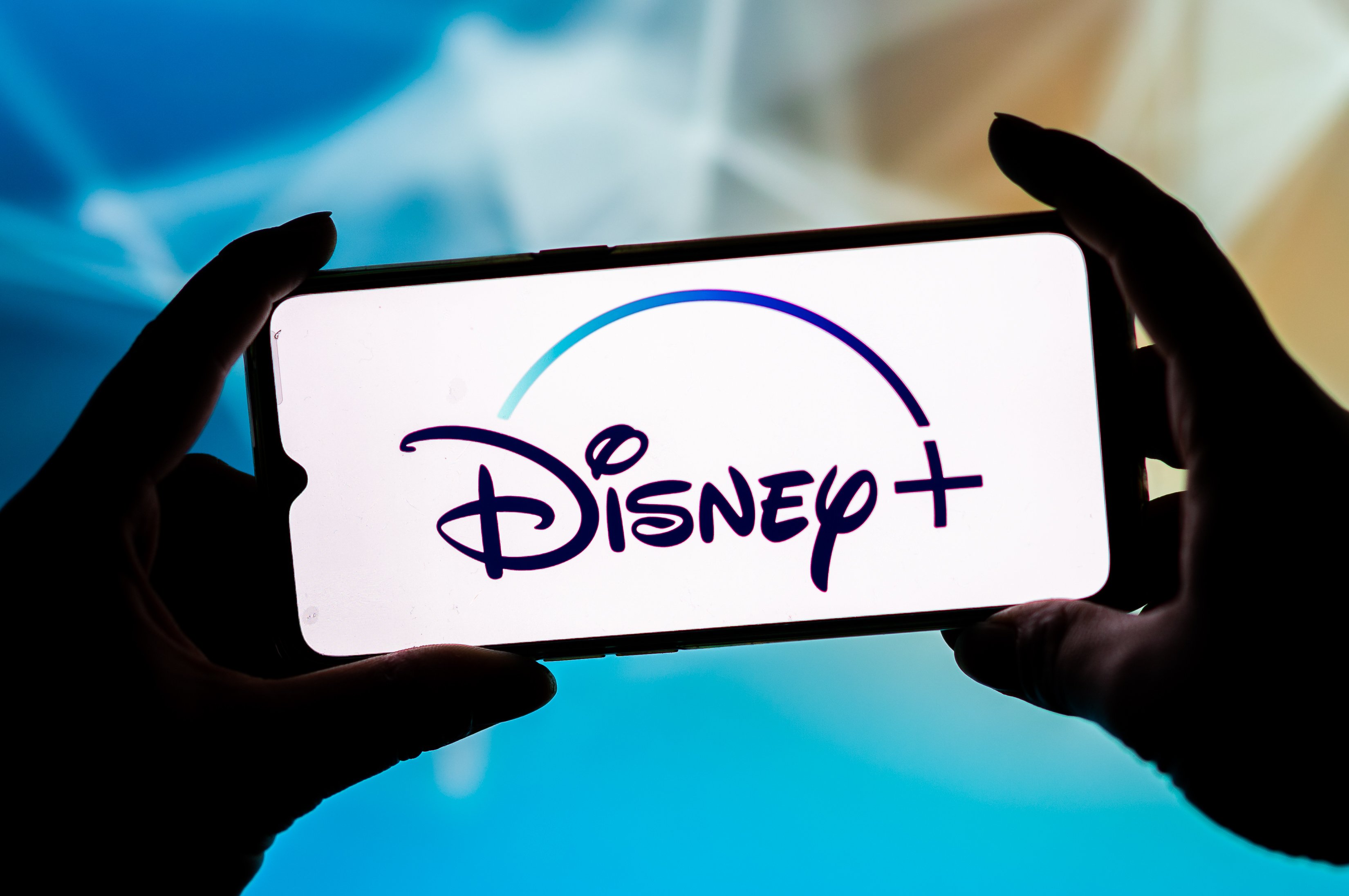 Disney+ logo shines on a phone screen, home of several Disney+ halloween movies