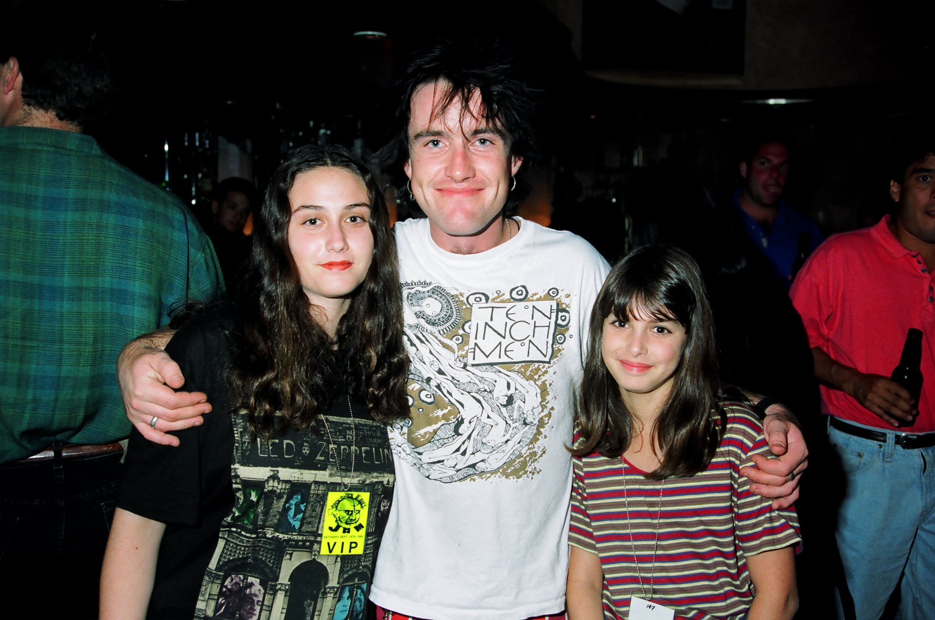 Dominic Griffin of 'The Real World Los Angeles' poses with his arms around two women at an event in 1993