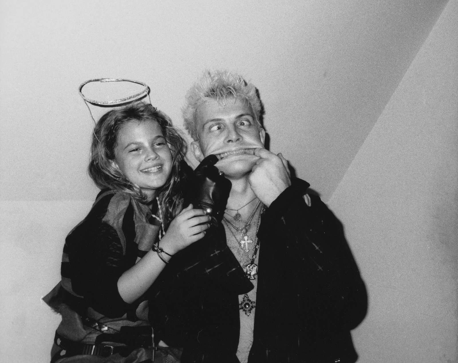 Drew Barrymore with Billy Idol at nightclub Limelight in 1986