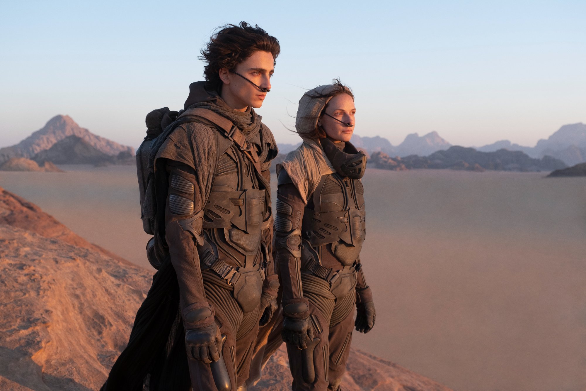 'Dune' actors Timothée Chalamet and Rebecca Ferguson looking out at the desert
