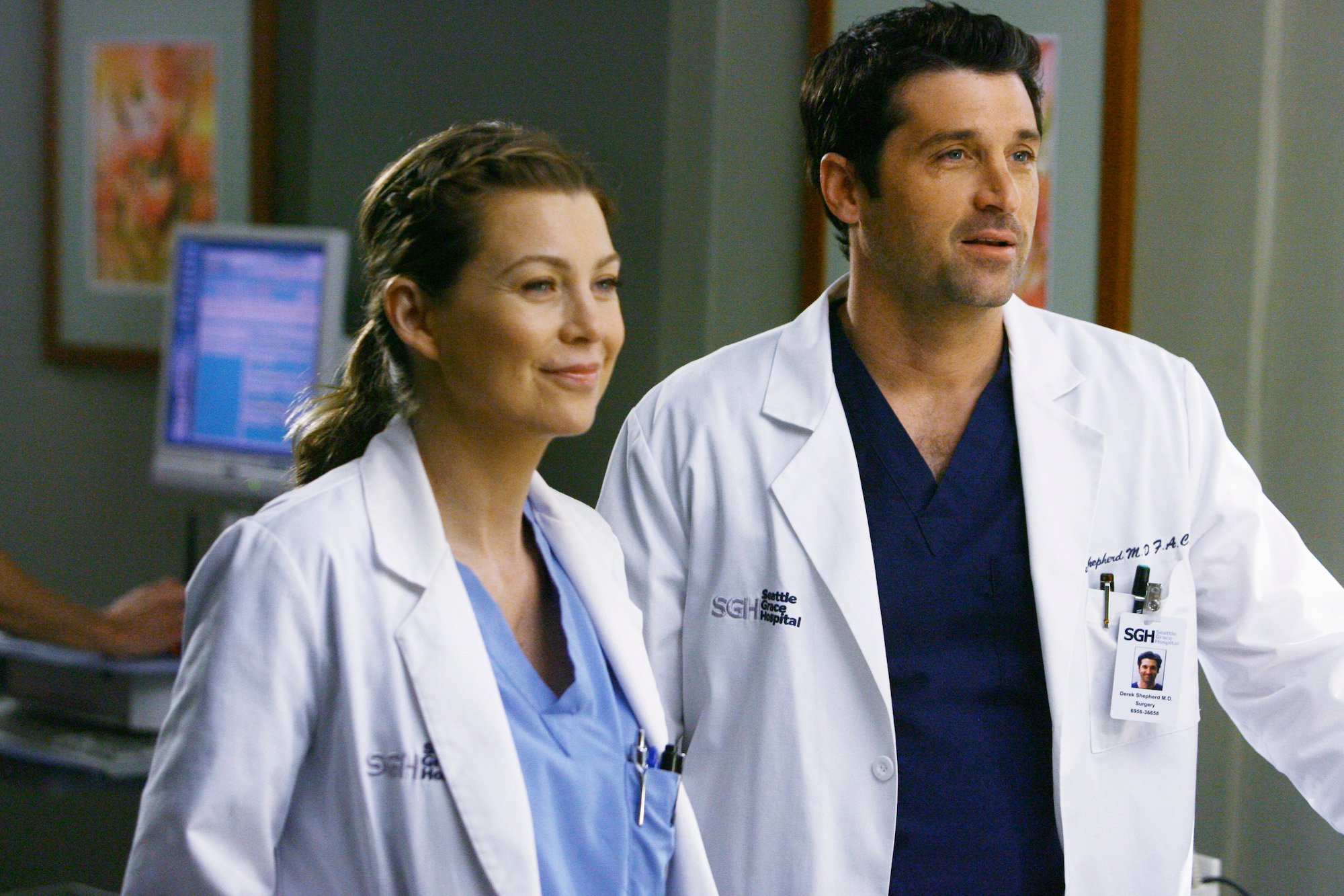 Ellen Pompeo and Patrick Dempsey dressed in white lab coats in 'Grey's Anatomy.'