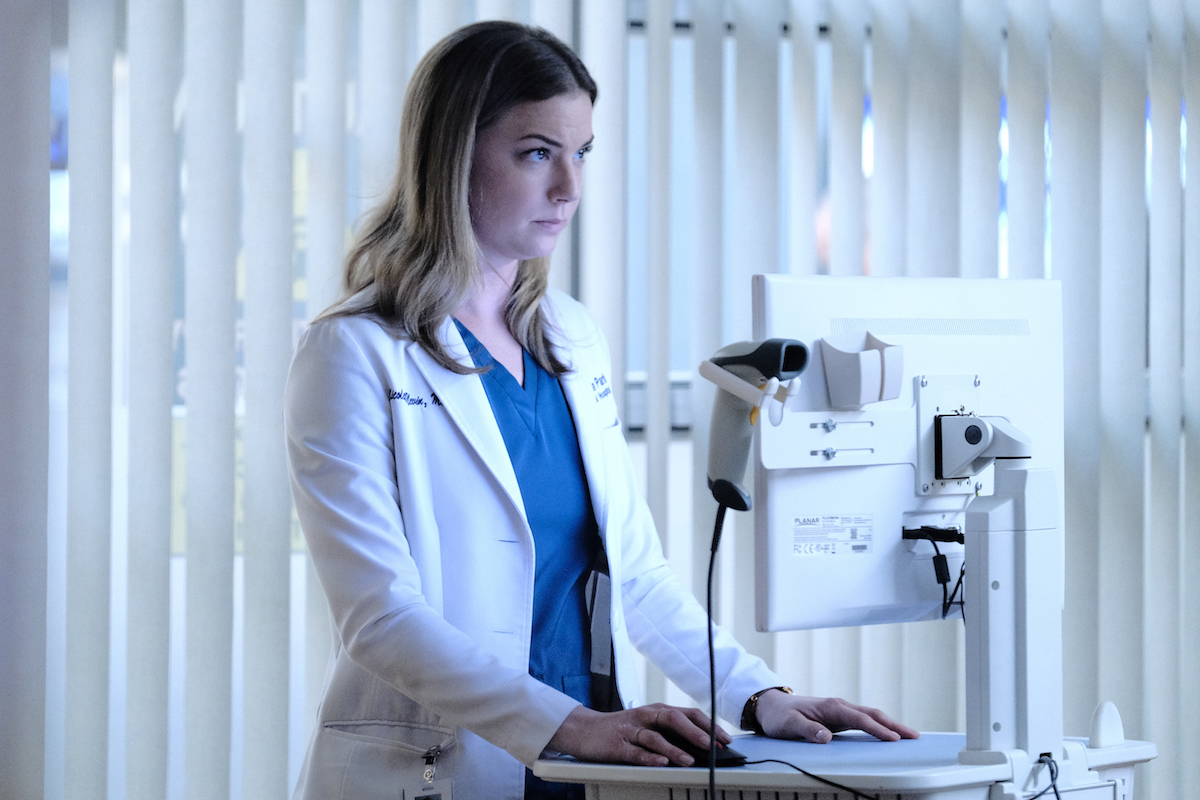 Emily VanCamp as Nic Nevin, wearing a white coat, in 'The Resident'