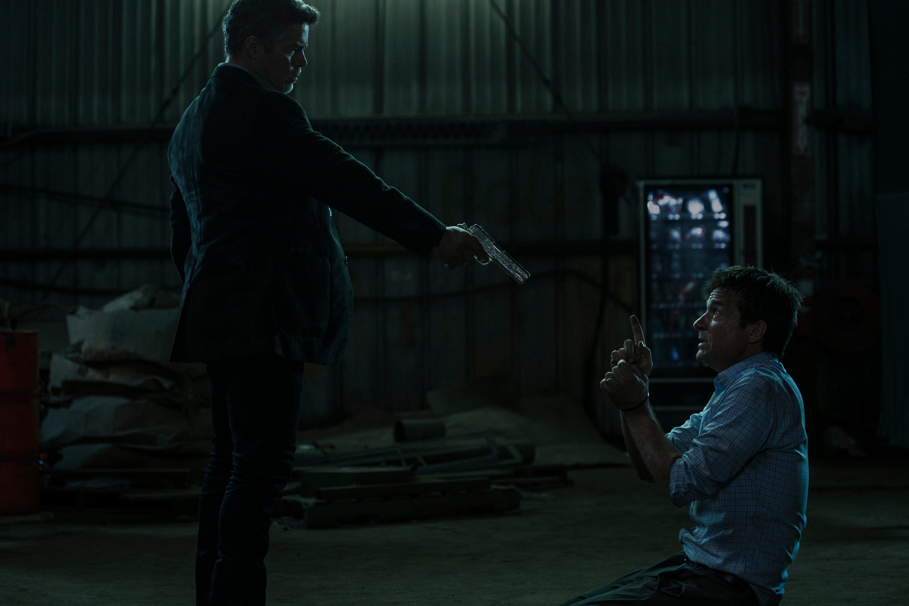 Esai Morales as Del holding a gun to Jason Bateman's Marty Byrde's head in the pilot episode of 'Ozark'