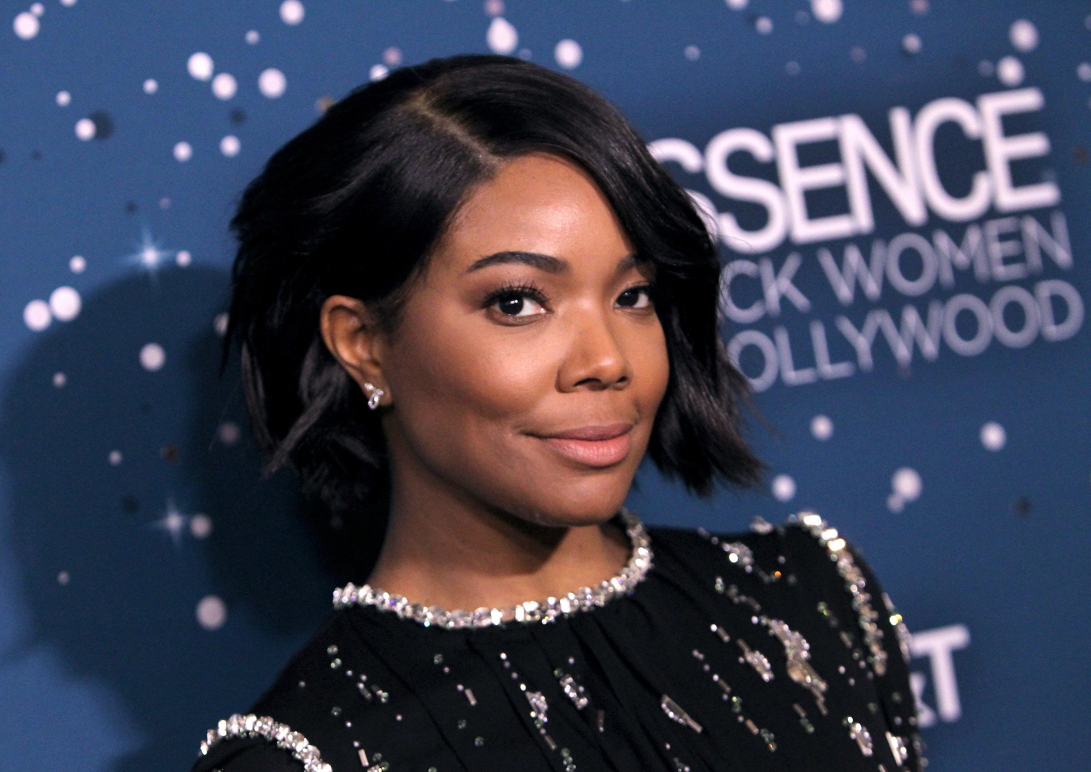 Gabrielle Union who starred in The Matrix smiles for the cameras