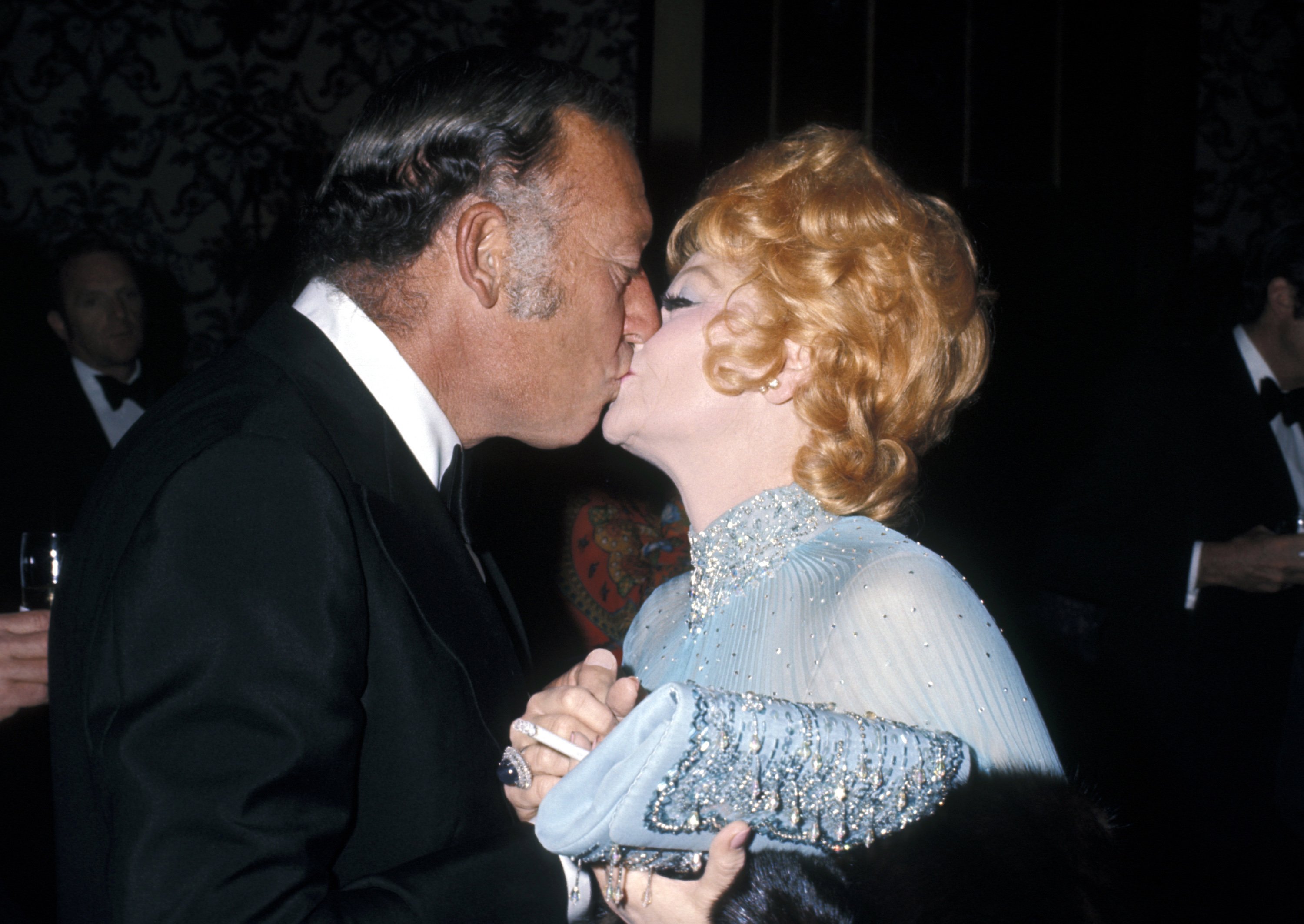 Gary Morton and Lucille Ball share a kiss during Eisenhower Benefit at Beverly Hills Hotel 