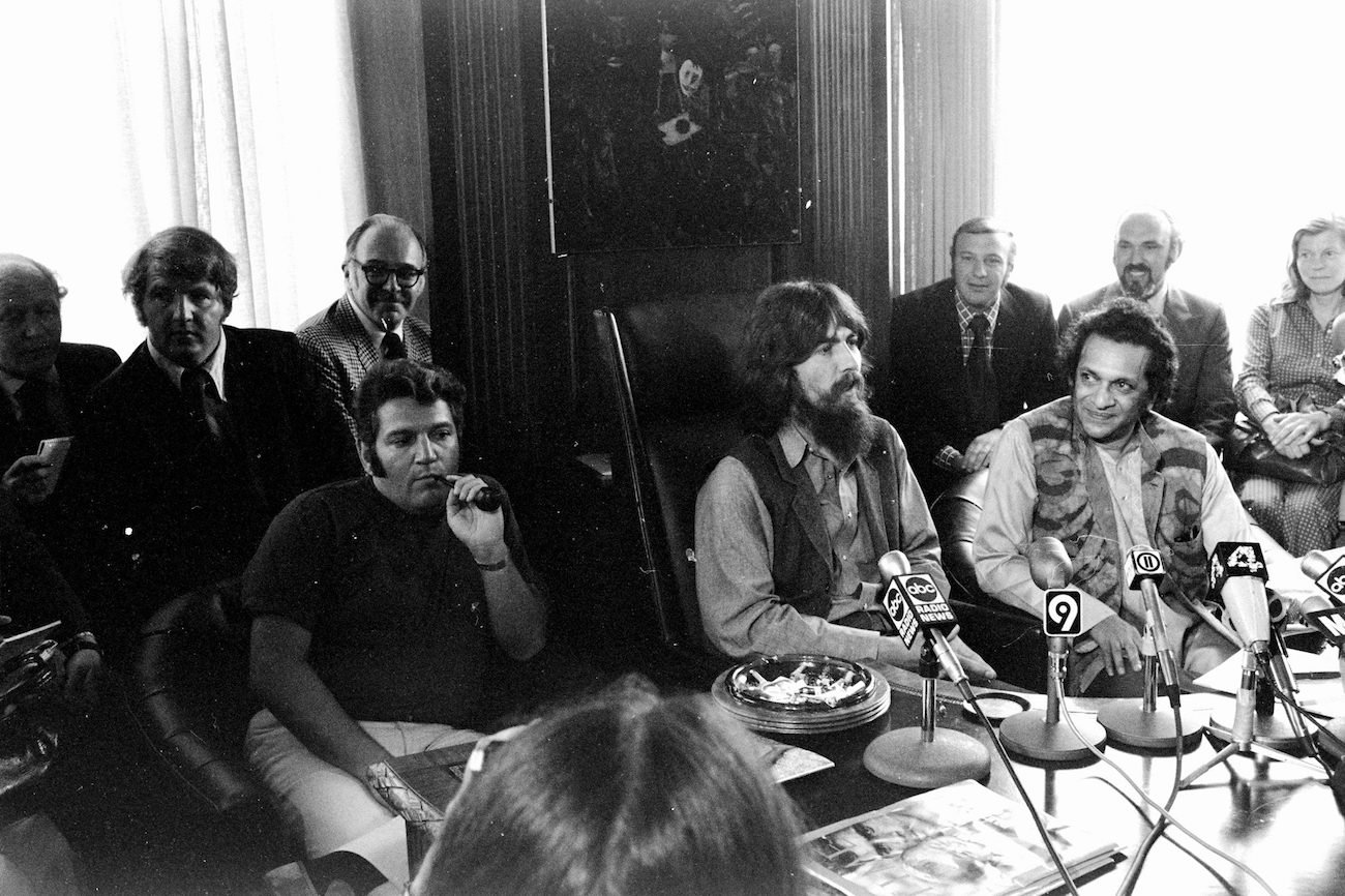 George Harrison and Ravi Shankar speaking to the press in 1971.