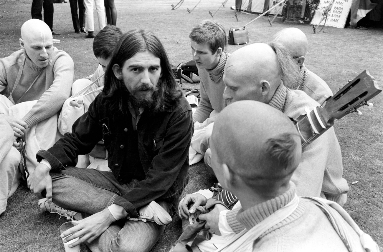 George Harrison siting with The Radha Krishna Temple in 1969.