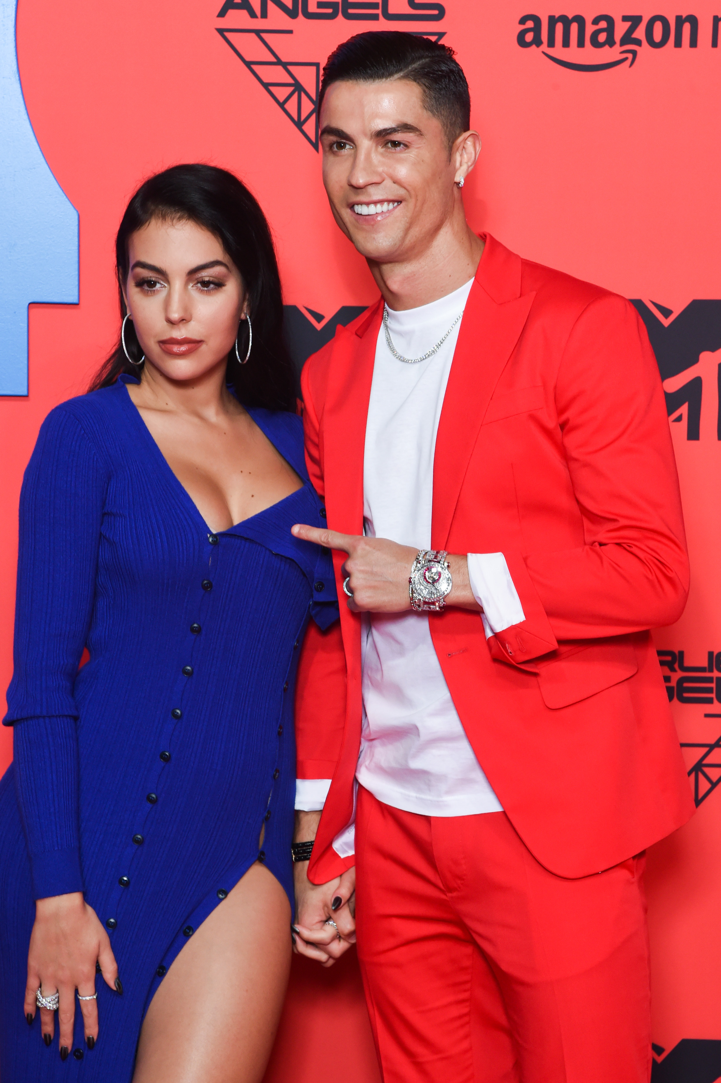 Georgina Rodriguez and Cristiano Ronaldo pose on the red carpet at the MTV EMAs