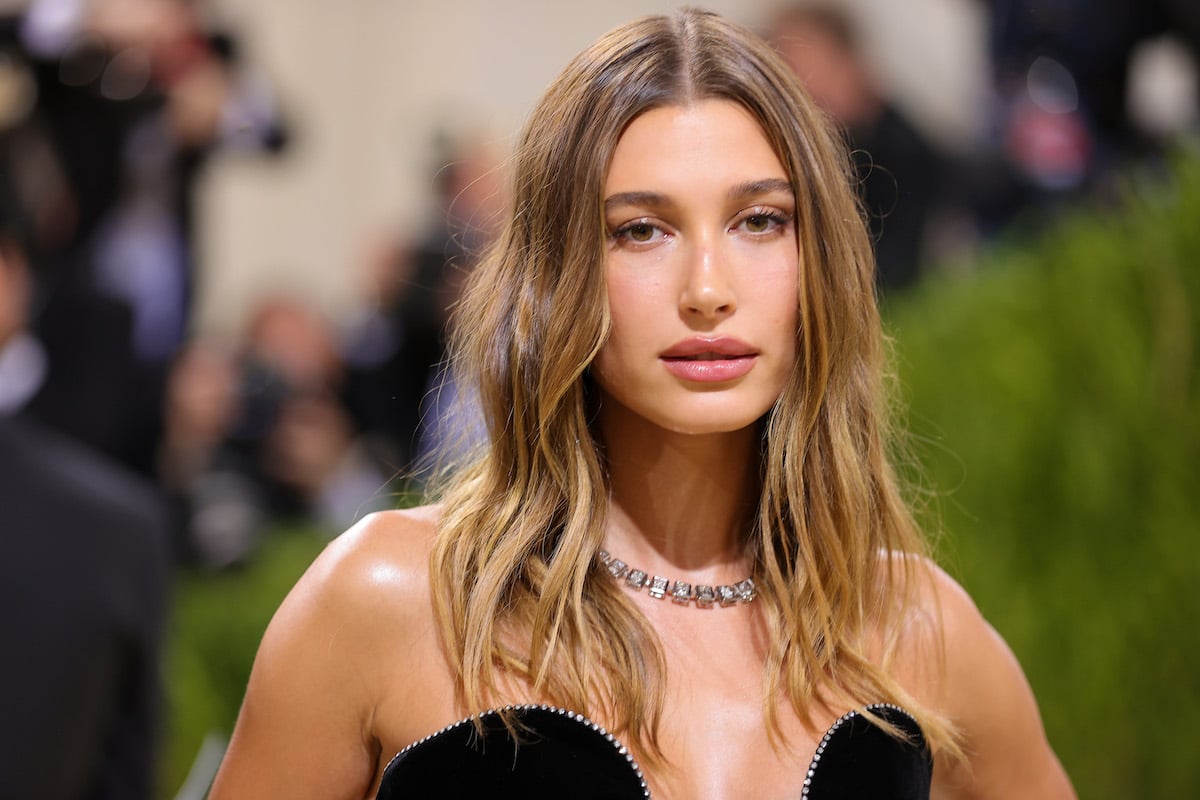 Hailey Bieber poses in a black dress at the 2021 Met Gala.