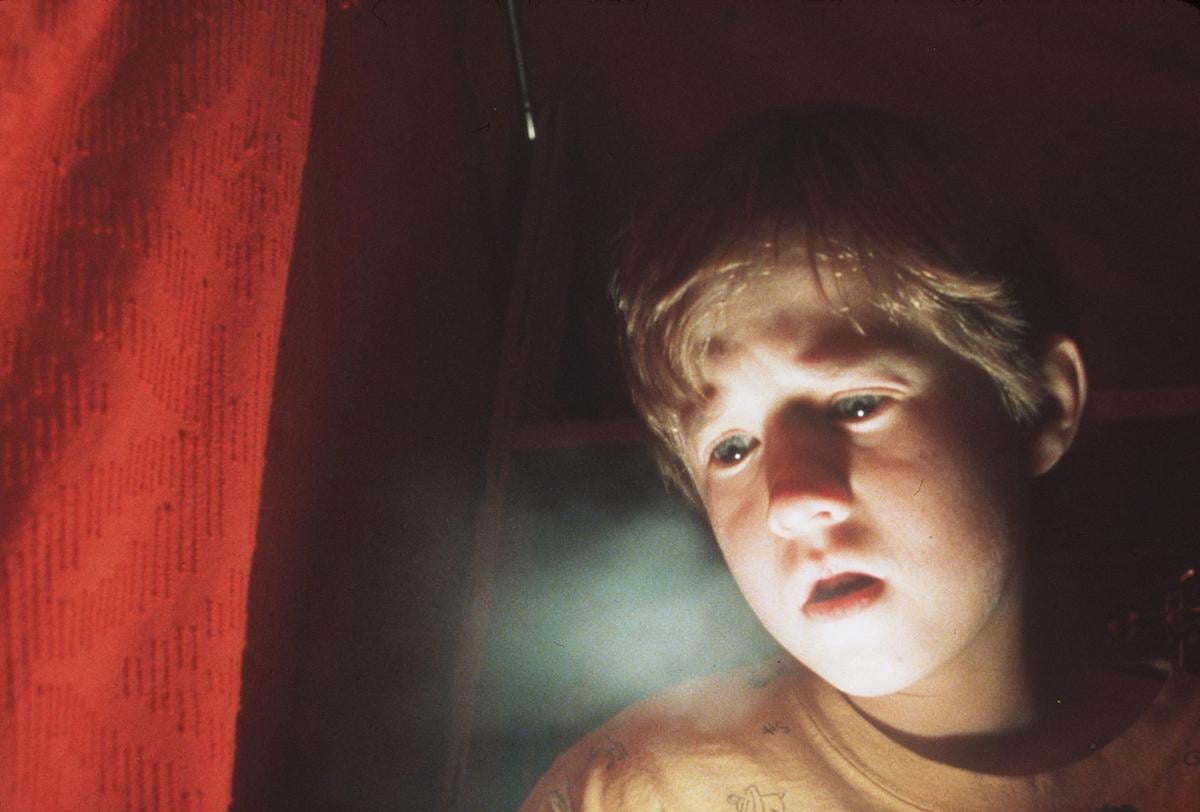 Haley Joel Osment looks on as