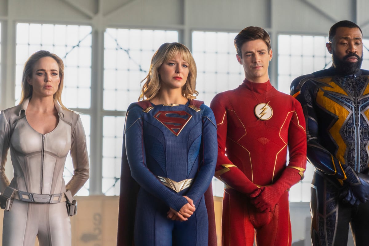 Arrowverse stars Caity Lotz,, Melissa Benoist, Grant Gustin, and Cress Williams, in character as Sara, Kara, Barry, and Jefferson, stand in the Hall of Justice at the end of 'Crisis on Infinite Earths.' All of them are wearing their superhero costumes, Sara as the White Canary, Kara as Supergirl, Barry as Flash, and Jefferson as Black Lightning. The Hall of Justice will be featured in the upcoming 'The Flash' Season 8 event, 'Armageddon.'