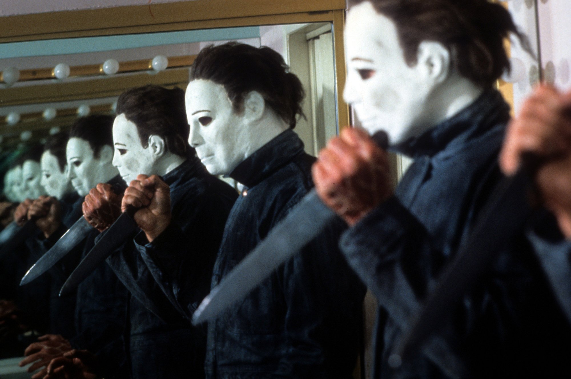 'Halloween 4: The Return of Michael Myers' George P. Wilbur as Michael Myers in mirror holding a knife