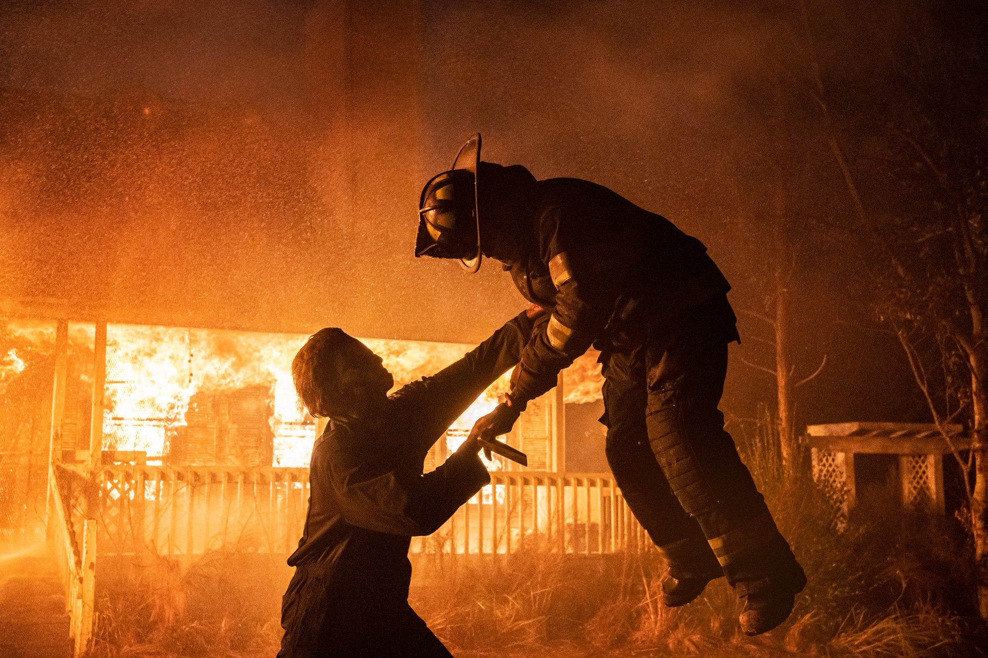 'Halloween Kills' Michael Myers killing a firefighter in front of a burning house