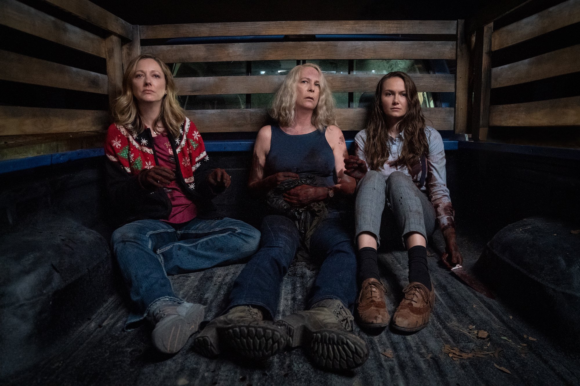 Halloween Kills: Jamie Lee Curtis, Judy Greer and Andi Matichak ride in a truck bed