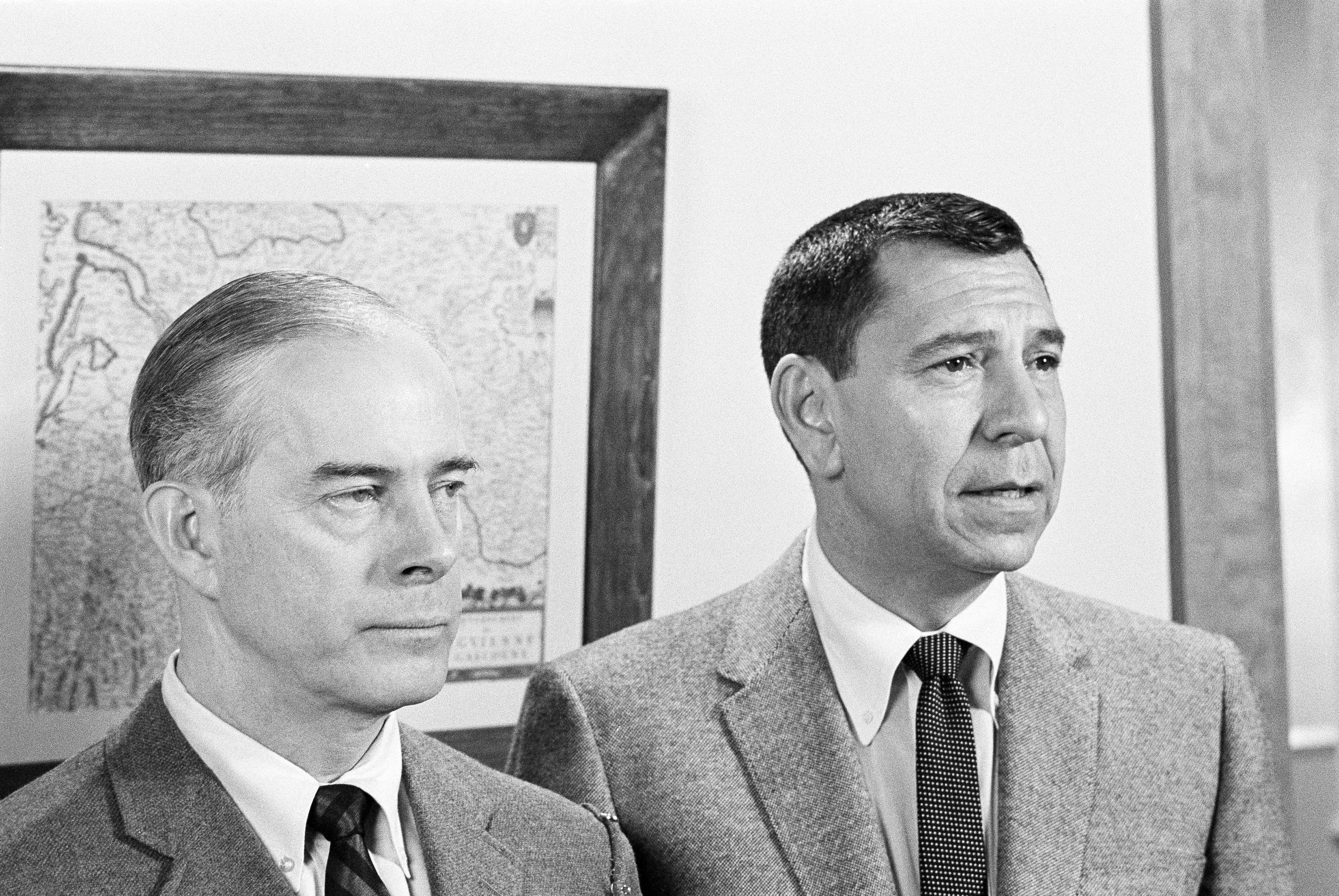 'Dragnet' actors Harry Morgan and Jack Webb dressed in suits in a black and white photo from the series.