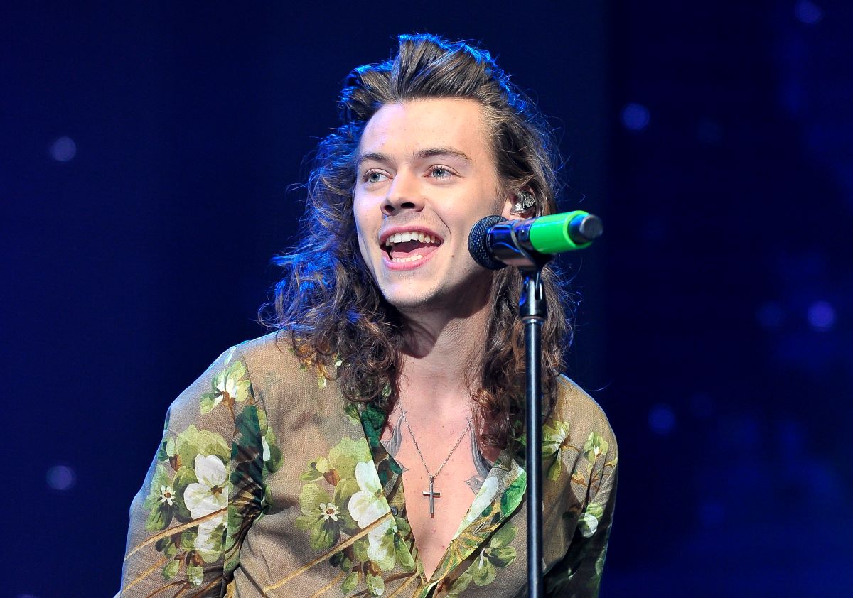 Harry Styles wearing a green shirt