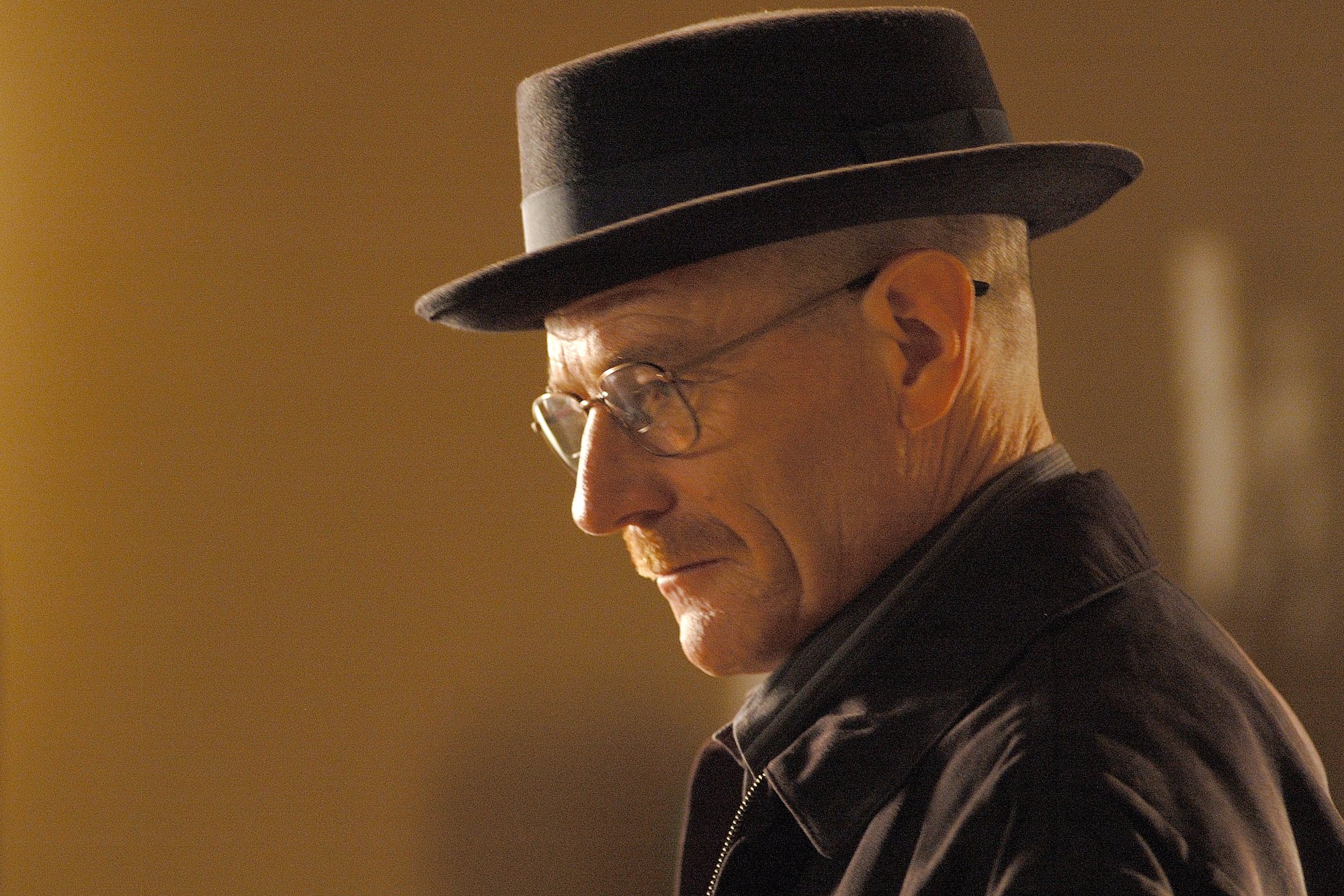 Bryan Cranston as Walter White/Heisenberg in 'Breaking Bad' Season 2. The image shows his side profile, and he's wearing his black pork pie hat.