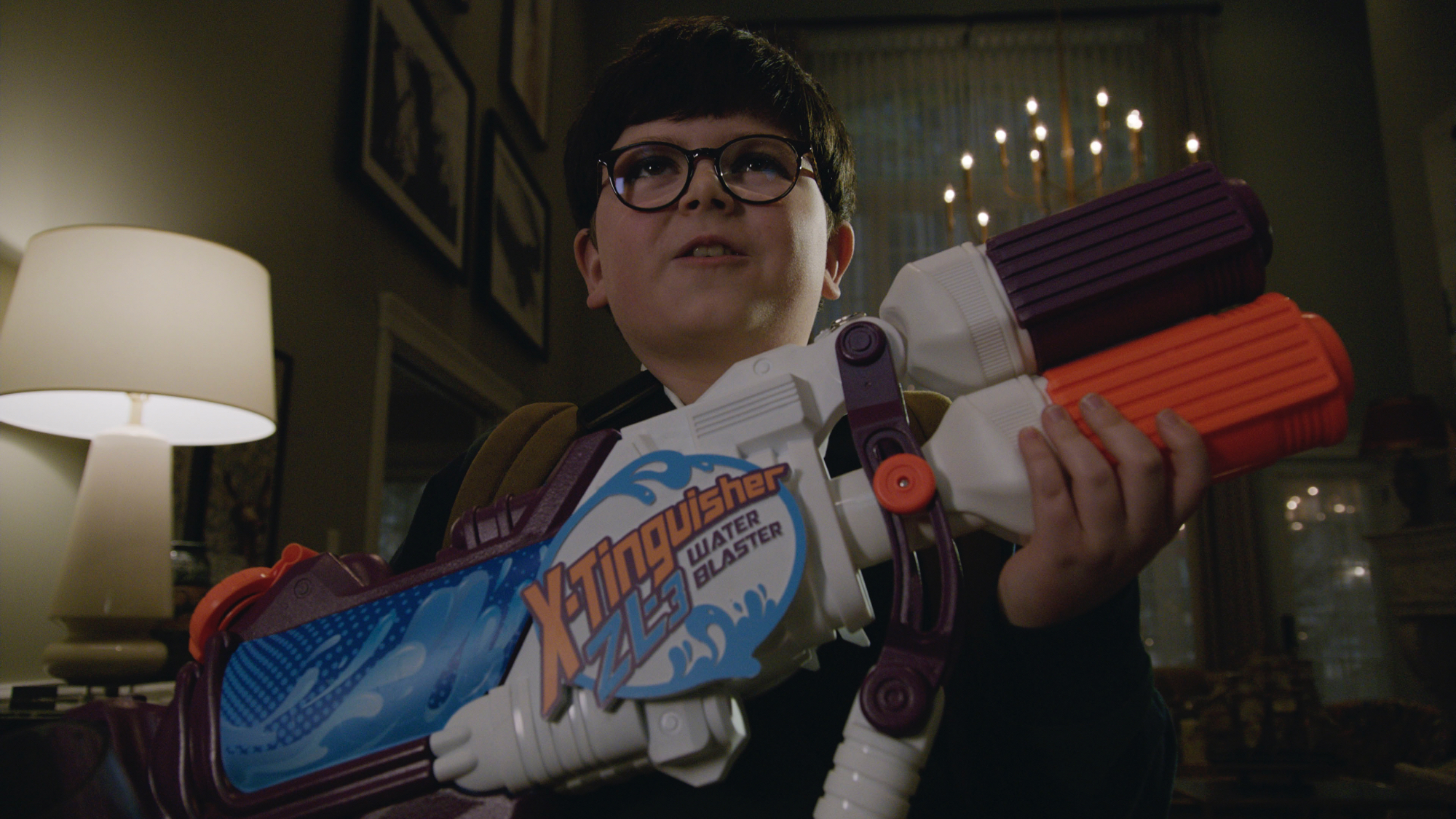 'Home Sweet Alone' actor Archie Yates as Max with a water blaster