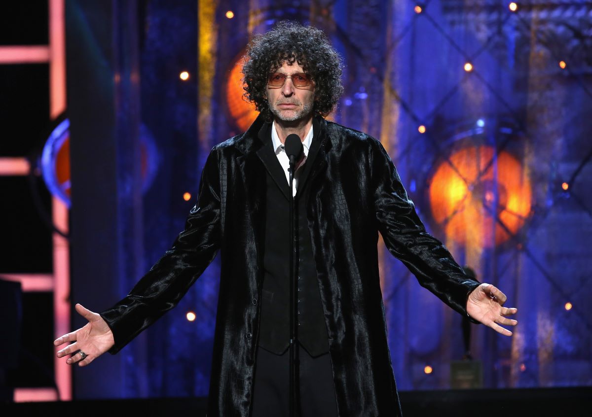Howard Stern in a black coat