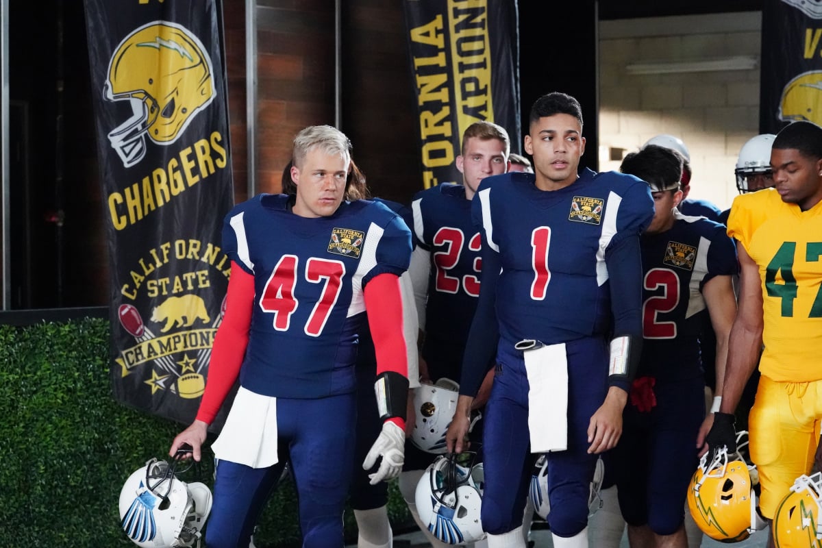 Hunter Clowdus, and Michael Evans standing in a football field in 'All American' Season 3.