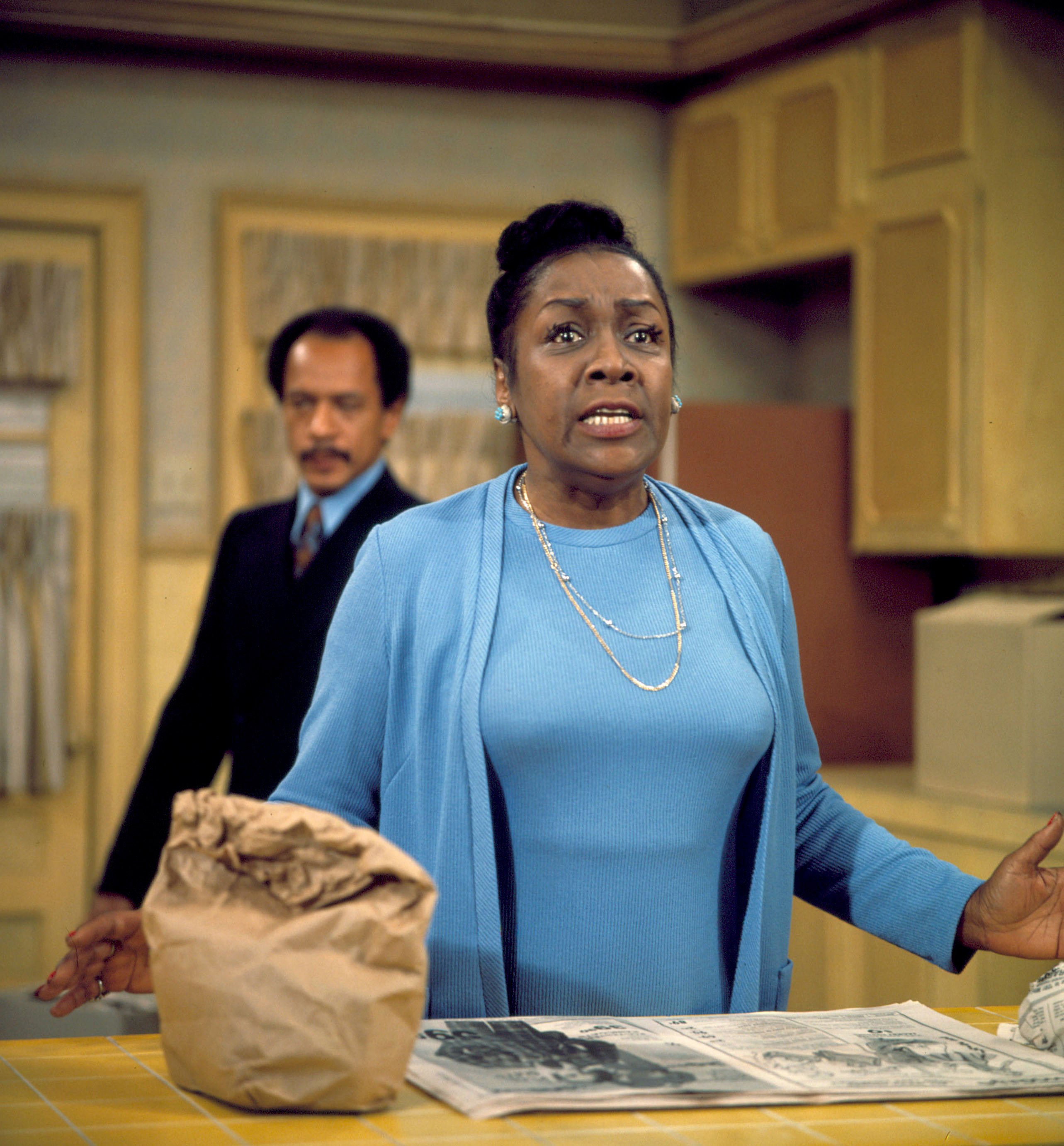 Isabel Sanford (as Louise Jefferson) and Sherman Hemsley (as George Jefferson) in a scene from The Jeffersons