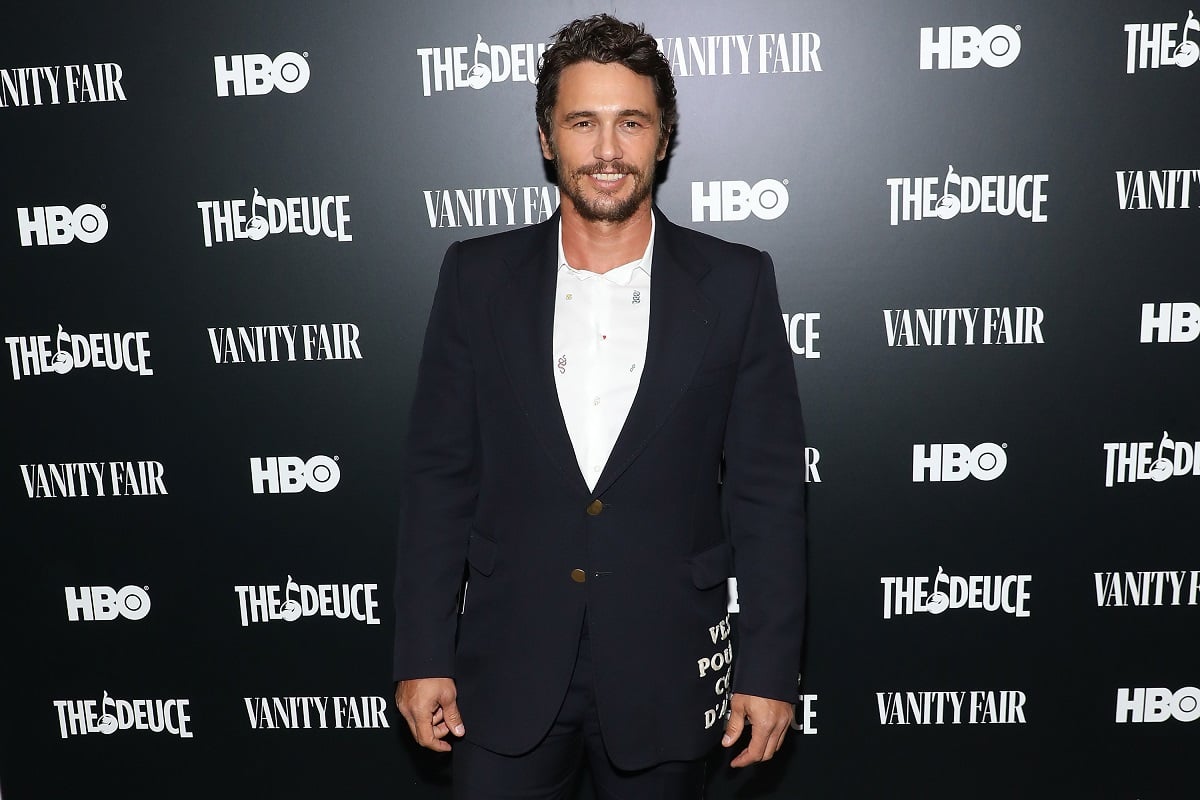 James Franco smiling in a suit.