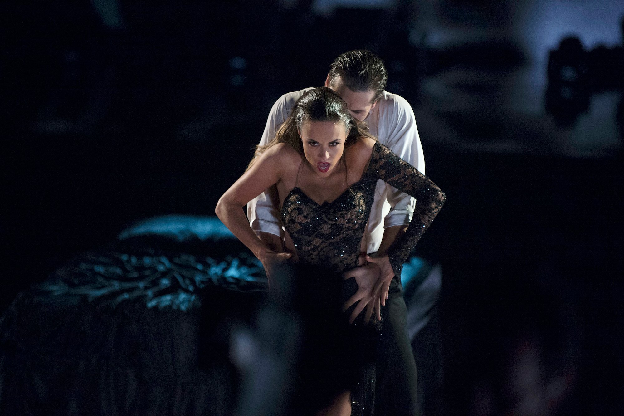 Gleb Savchenko holds Jana Kramer from behind as they perform their 'bed dance' in season 23 of 'Dancing with the Stars'
