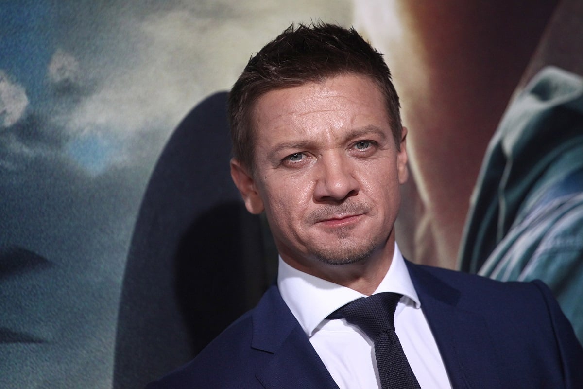 Jeremy Renner wearing a blue suit.