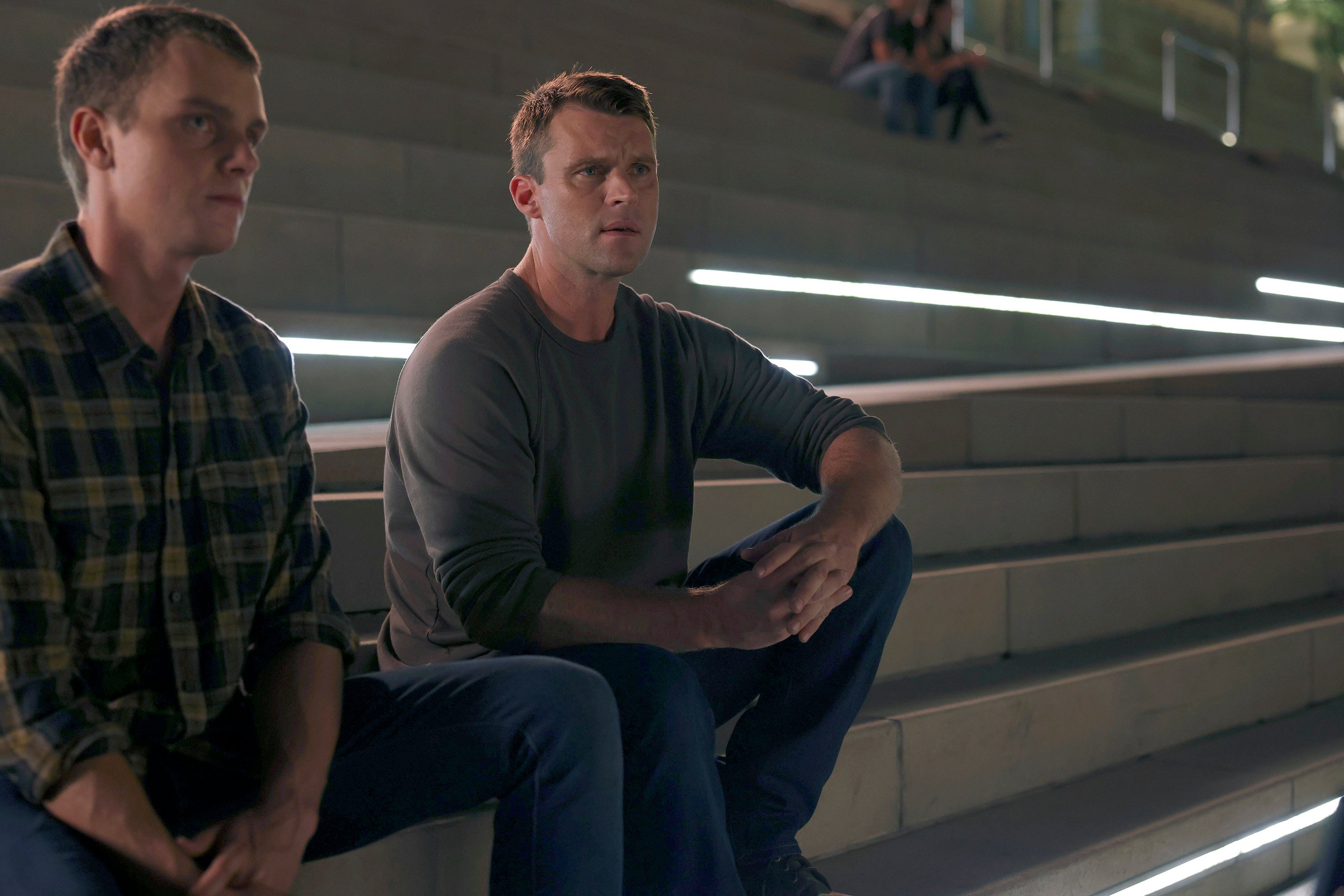 Matt Casey (Jesse Spencer) sitting on bleachers on 'Chicago Fire'