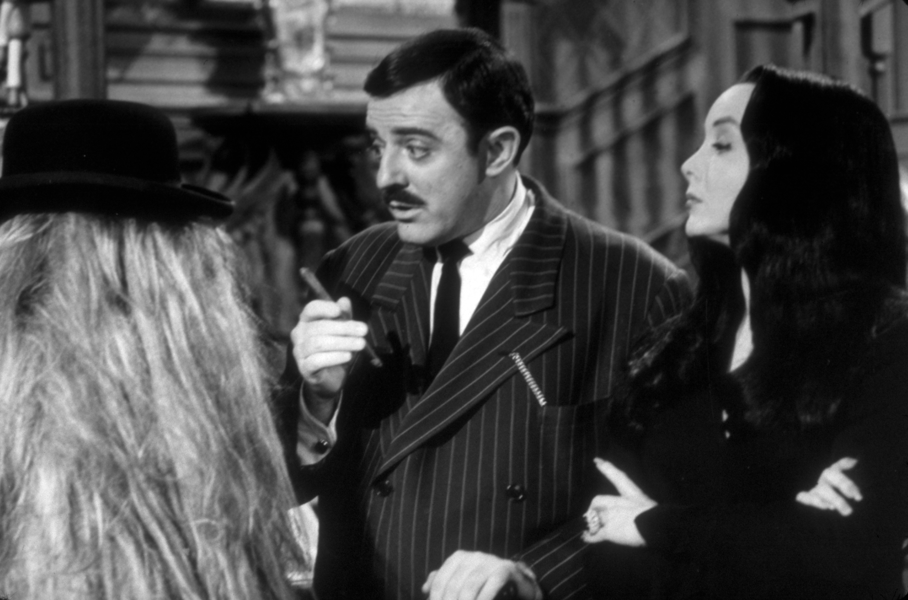 'The Addams Family' stars John Astin and Carolyn Jones as Gomez and Morticia Addams in a scene from the series.