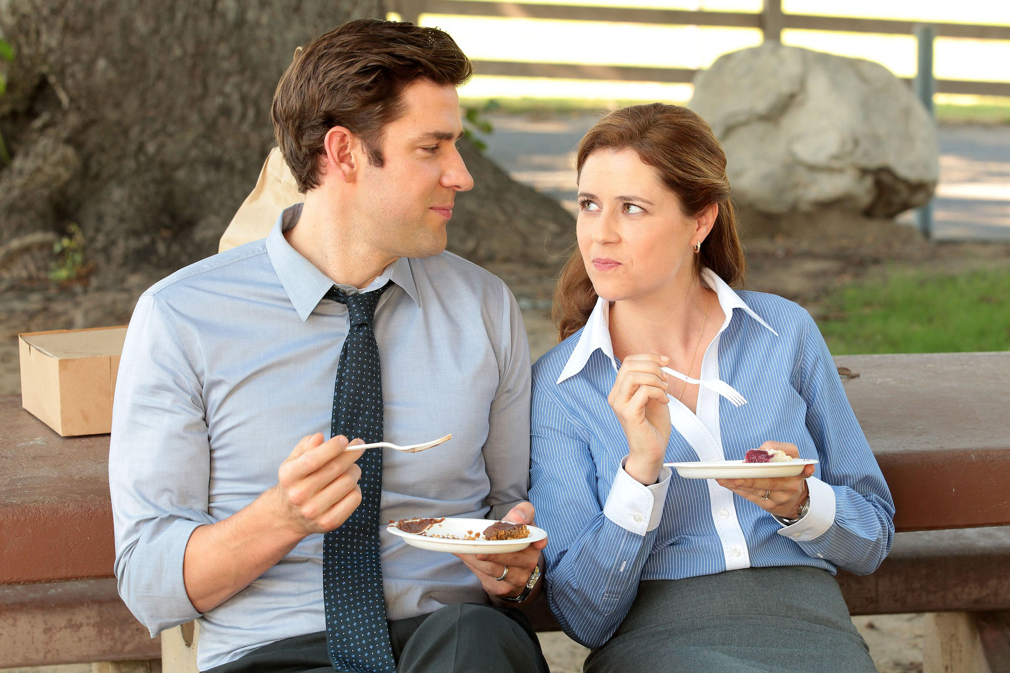 John Krasinski and Jenna Fischer eating cake in 'The Office' Season 9.